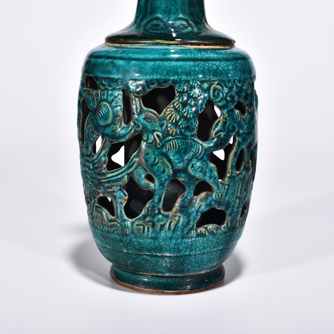 Five Dynasties Chai porcelain peacock green glaze hollow bottle with auspicious animal