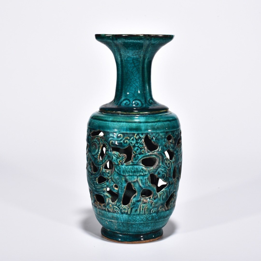 Five Dynasties Chai porcelain peacock green glaze hollow bottle with auspicious animal