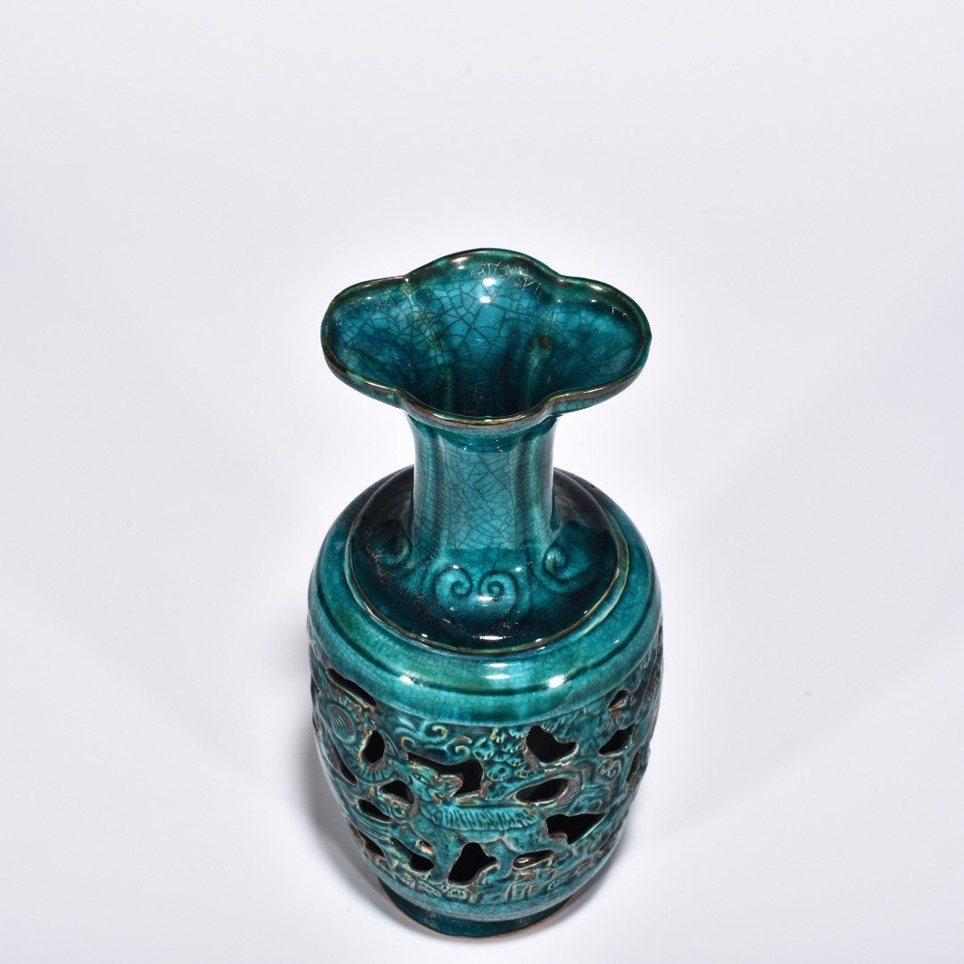 Five Dynasties Chai porcelain peacock green glaze hollow bottle with auspicious animal