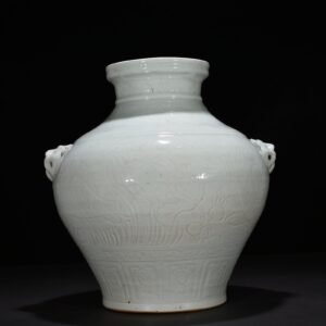 Yuan Dynasty egg white glaze carved animal ear jar with fish and algae pattern