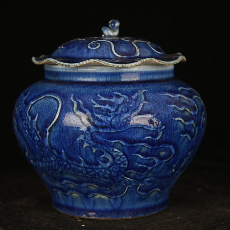 Yuan Dynasty blue glaze carved dragon pattern lotus leaf jar
