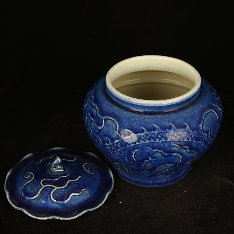 Yuan Dynasty blue glaze carved dragon pattern lotus leaf jar