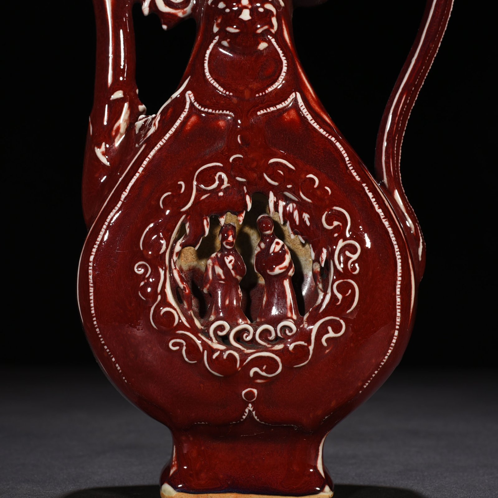 Yuan Dynasty ruby ​​red glaze hollow figure holding pot
