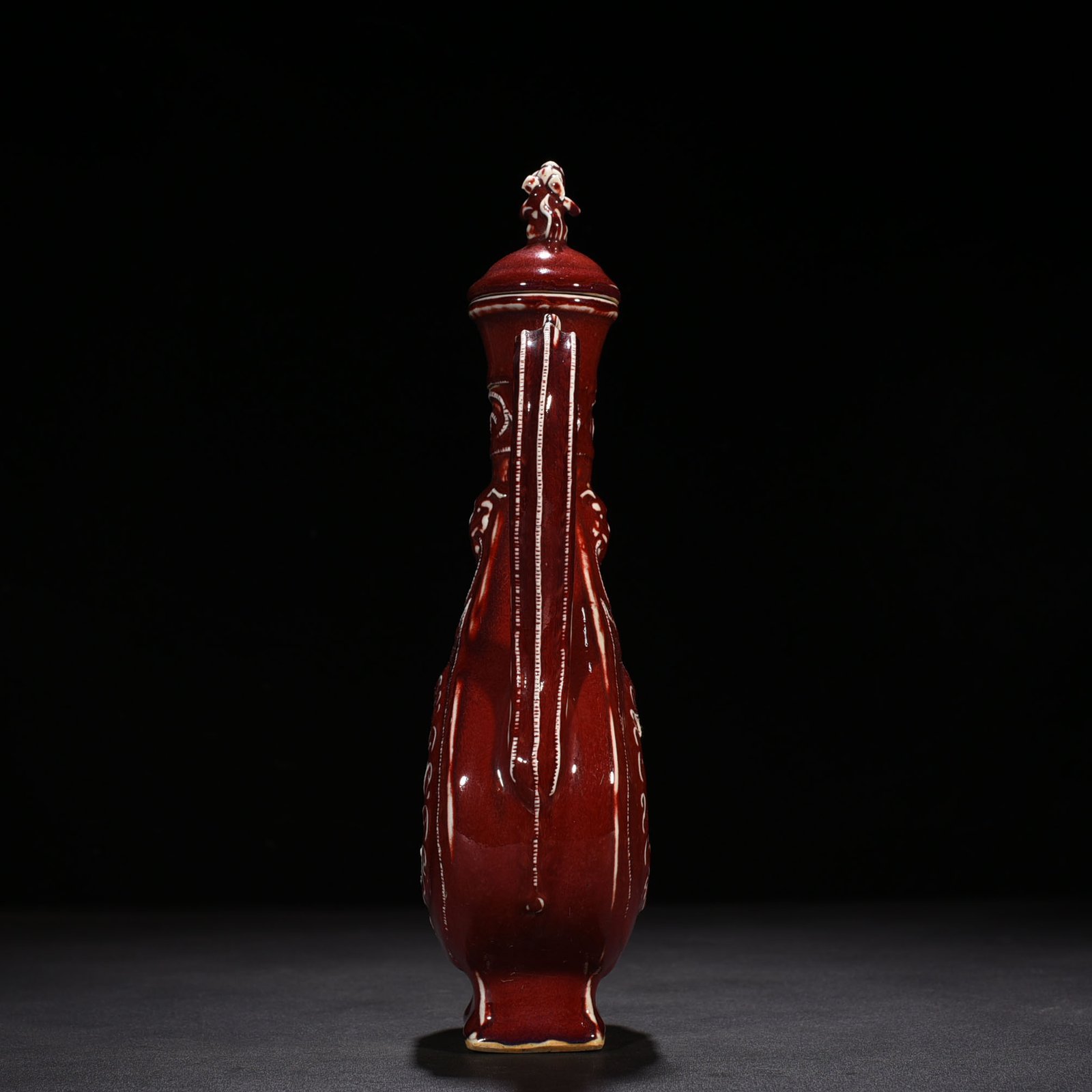 Yuan Dynasty ruby ​​red glaze hollow figure holding pot