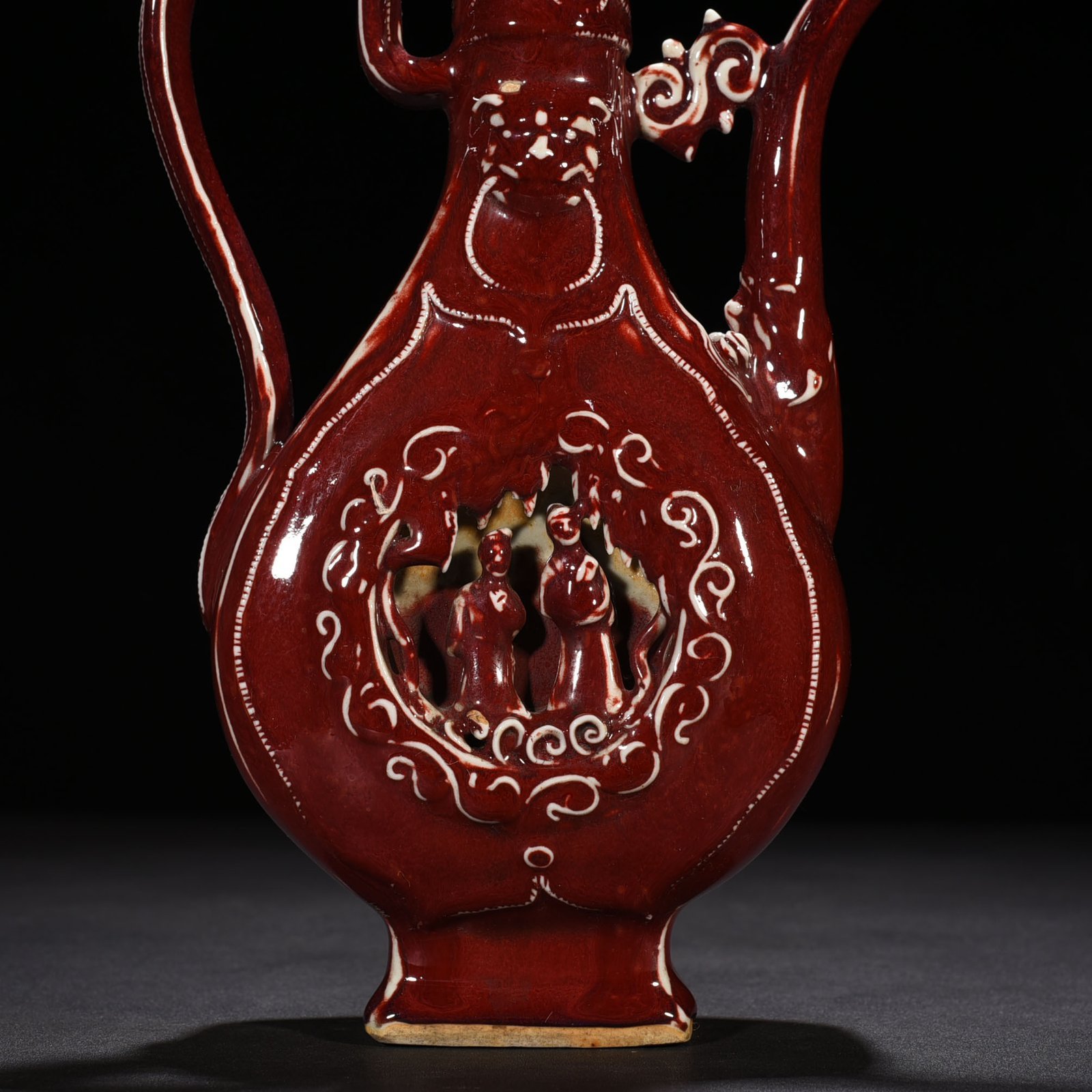 Yuan Dynasty ruby ​​red glaze hollow figure holding pot