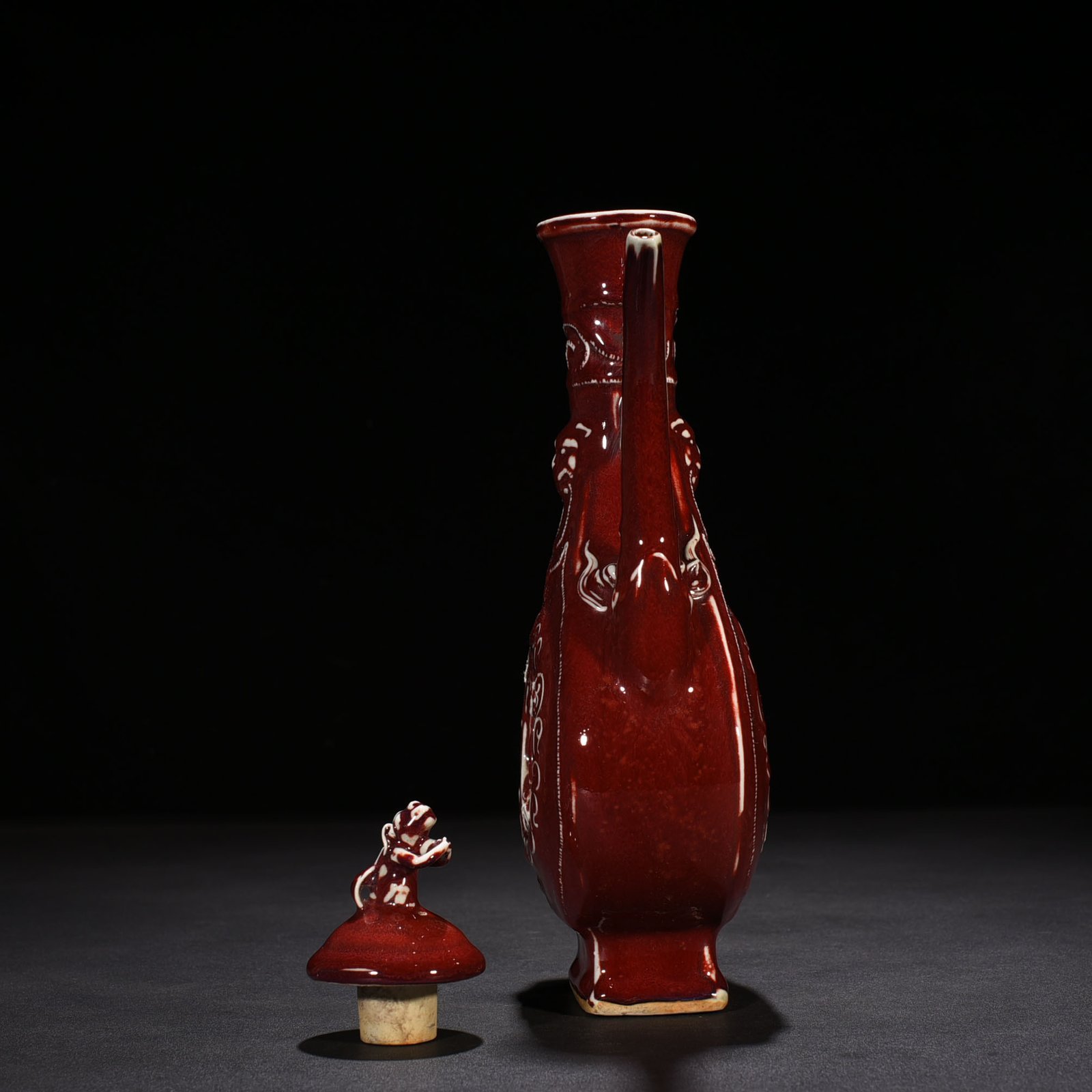 Yuan Dynasty ruby ​​red glaze hollow figure holding pot