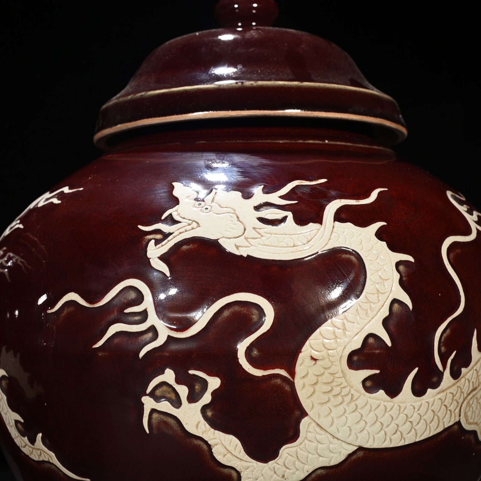Yuan Dynasty red glaze engraved white dragon cover jar