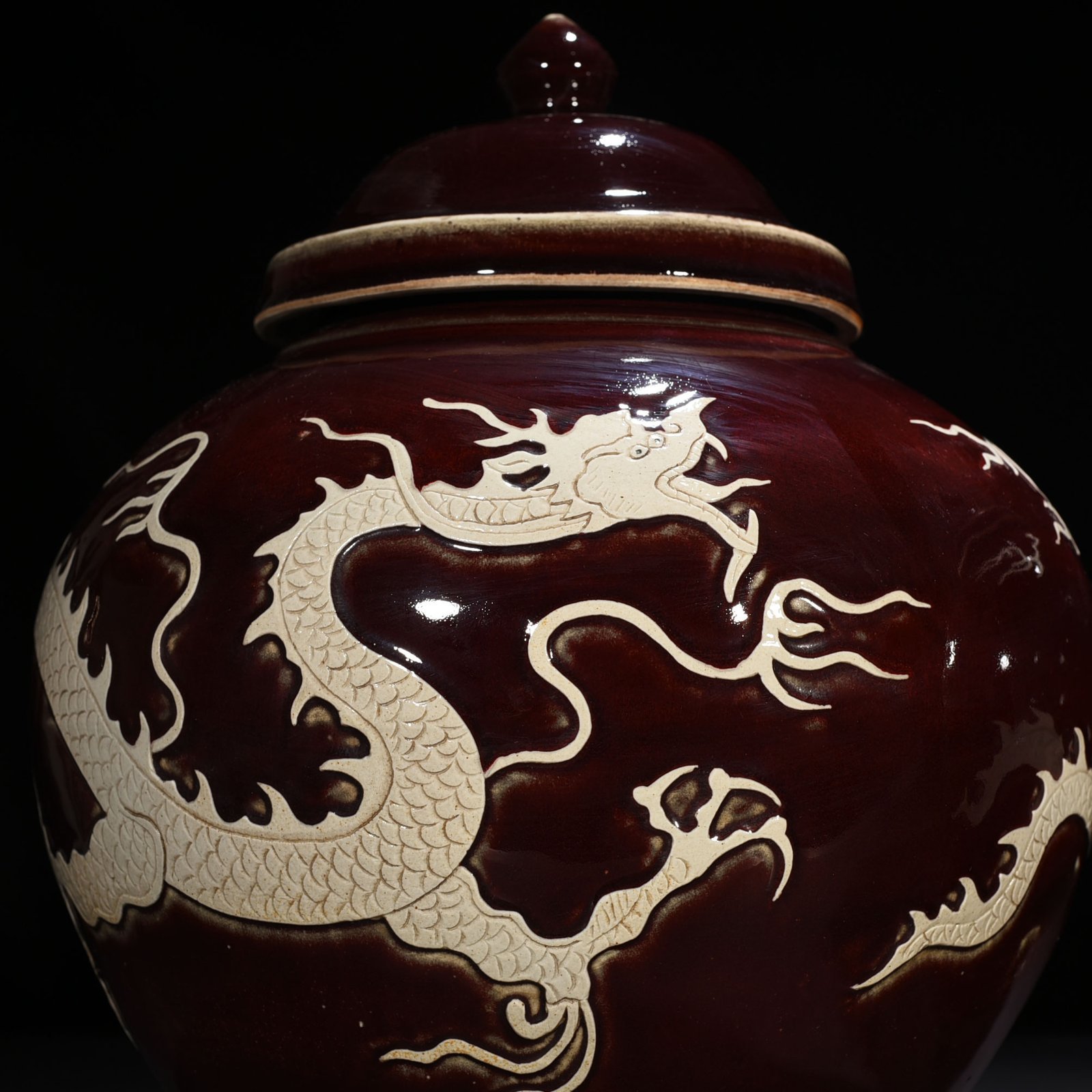 Yuan Dynasty red glaze engraved white dragon cover jar