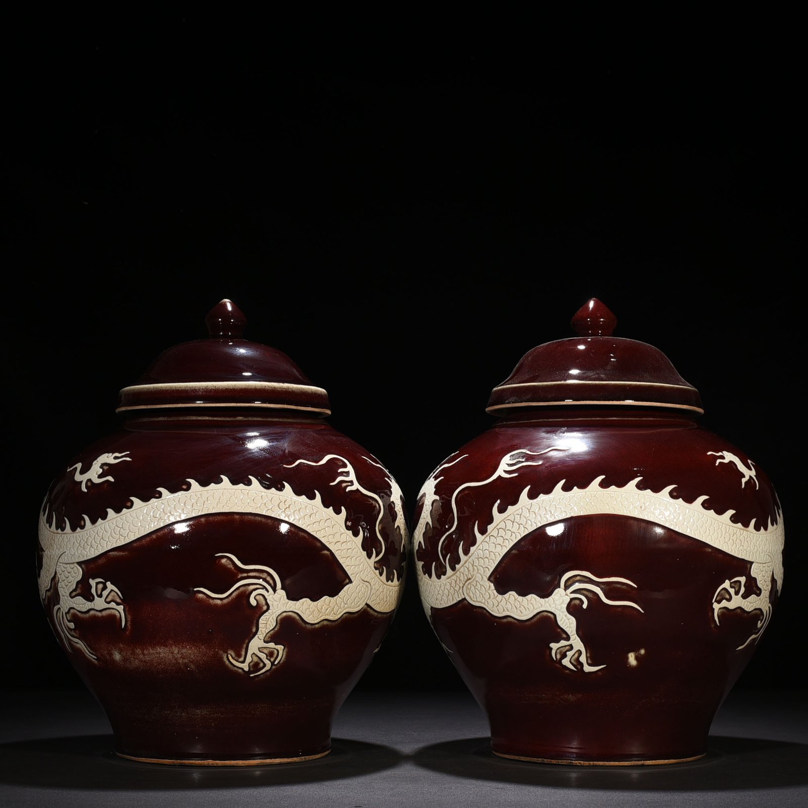 Yuan Dynasty red glaze engraved white dragon cover jar