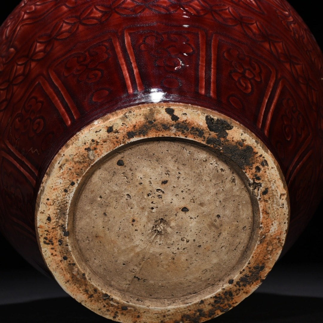 Yuan Dynasty red glaze engraved jar with peony pattern on branches