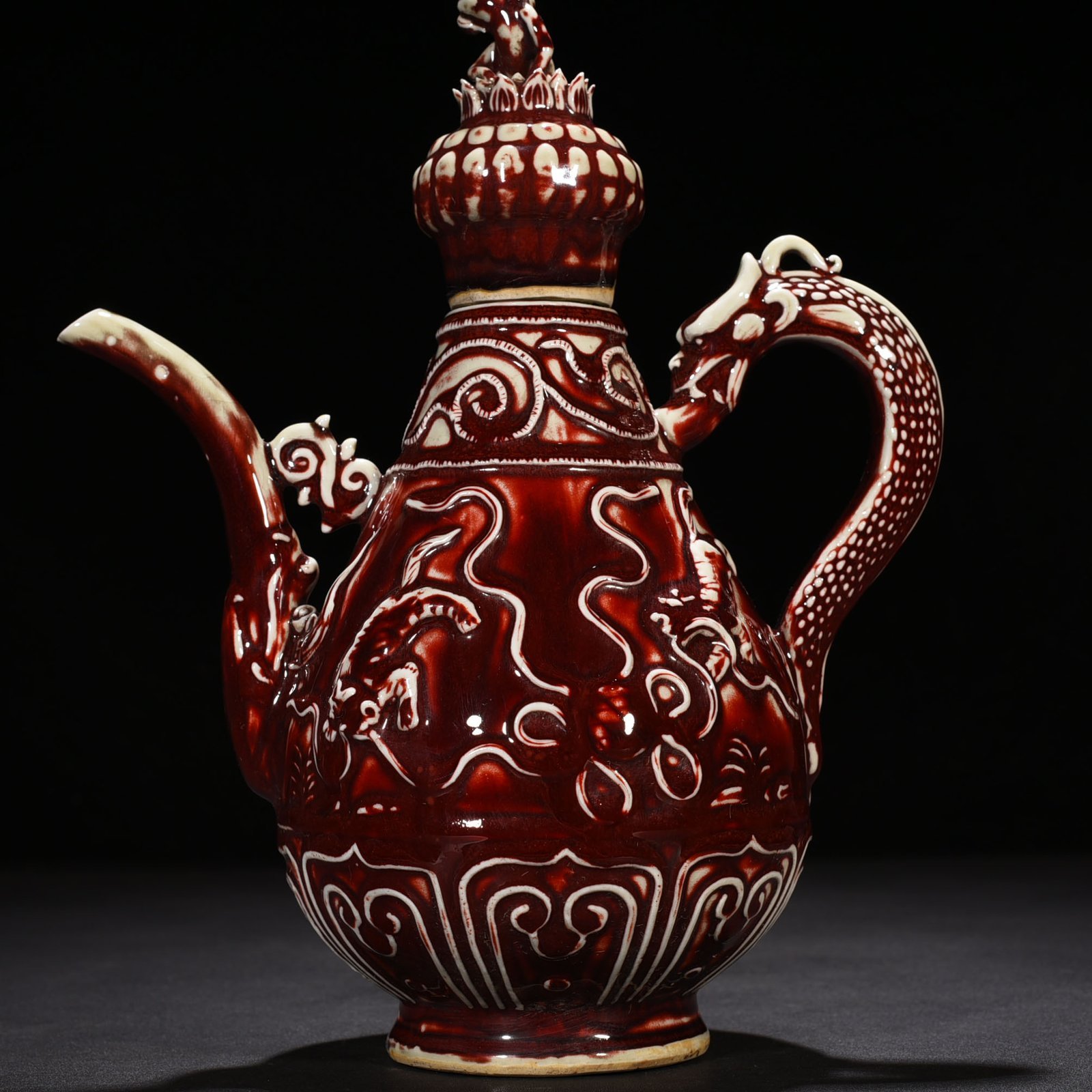 Yuan Dynasty red glaze embossed lion rolling hydrangea pattern holding pot
