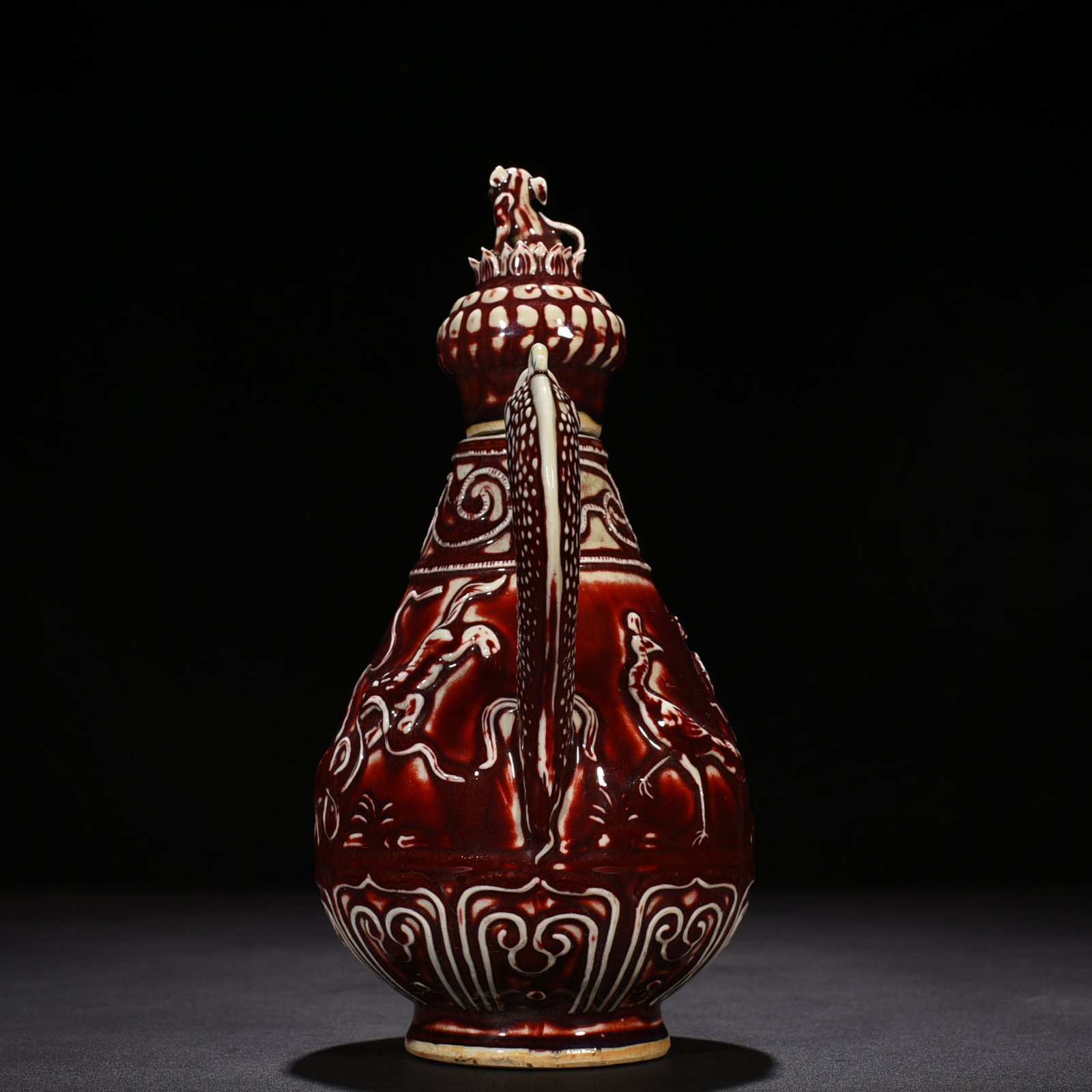 Yuan Dynasty red glaze embossed lion rolling hydrangea pattern holding pot