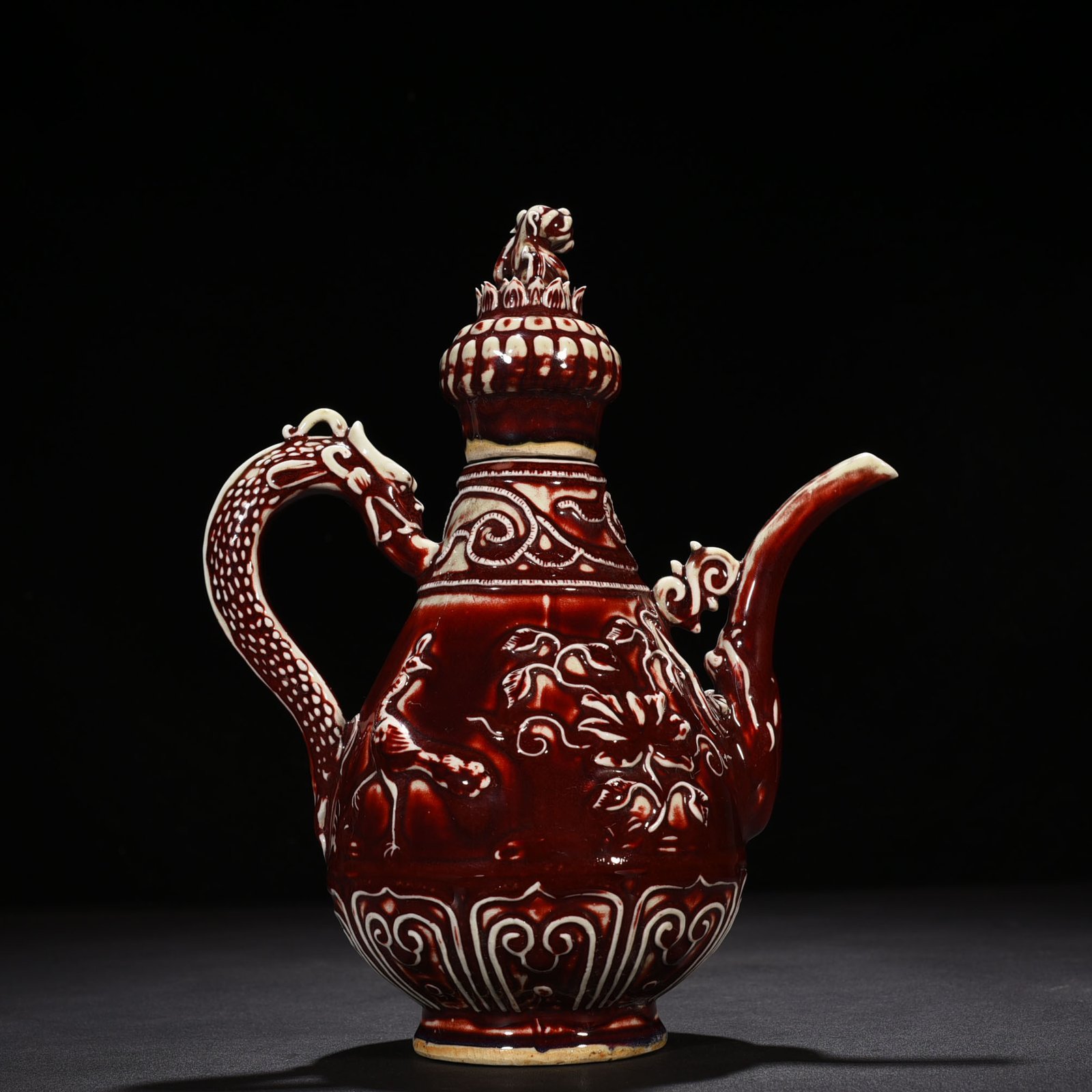 Yuan Dynasty red glaze embossed lion rolling hydrangea pattern holding pot