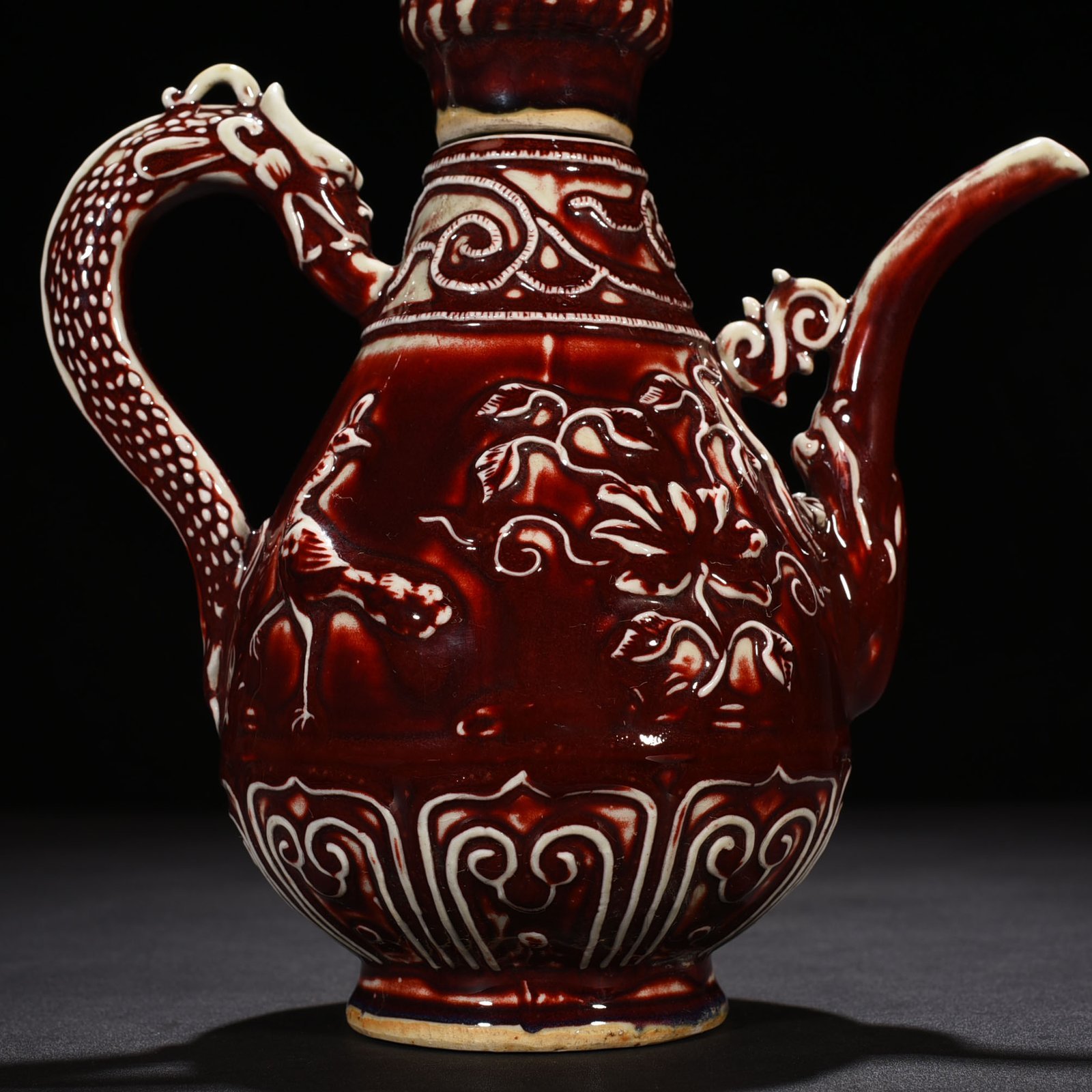 Yuan Dynasty red glaze embossed lion rolling hydrangea pattern holding pot