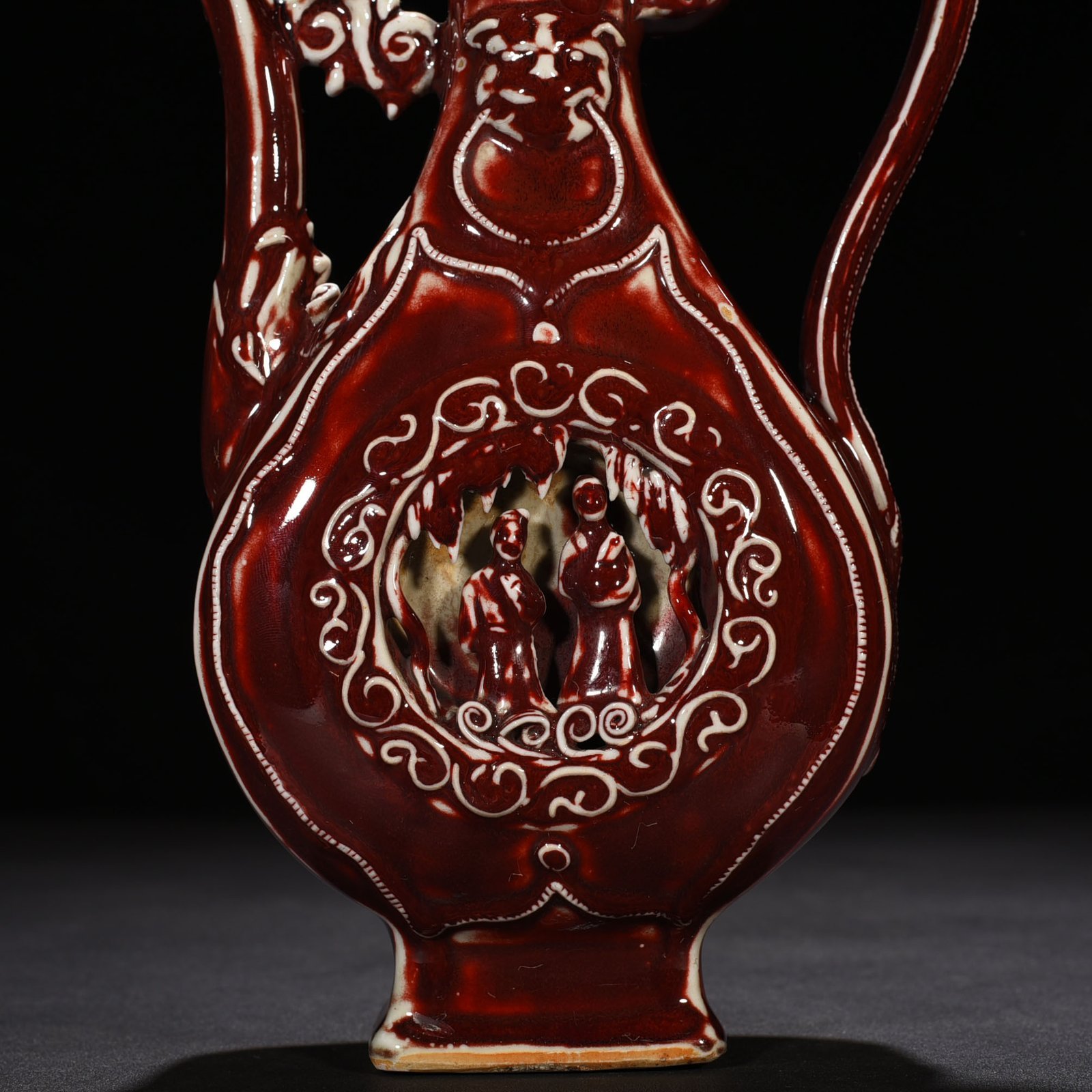 Yuan Dynasty red glaze hollow figure pattern holding pot