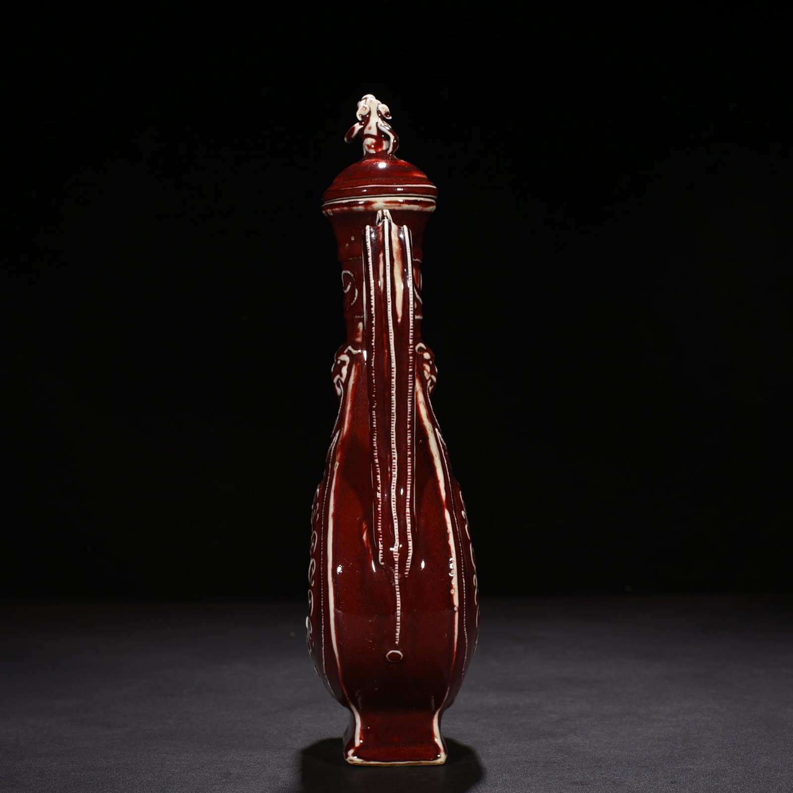 Yuan Dynasty red glaze hollow figure pattern holding pot