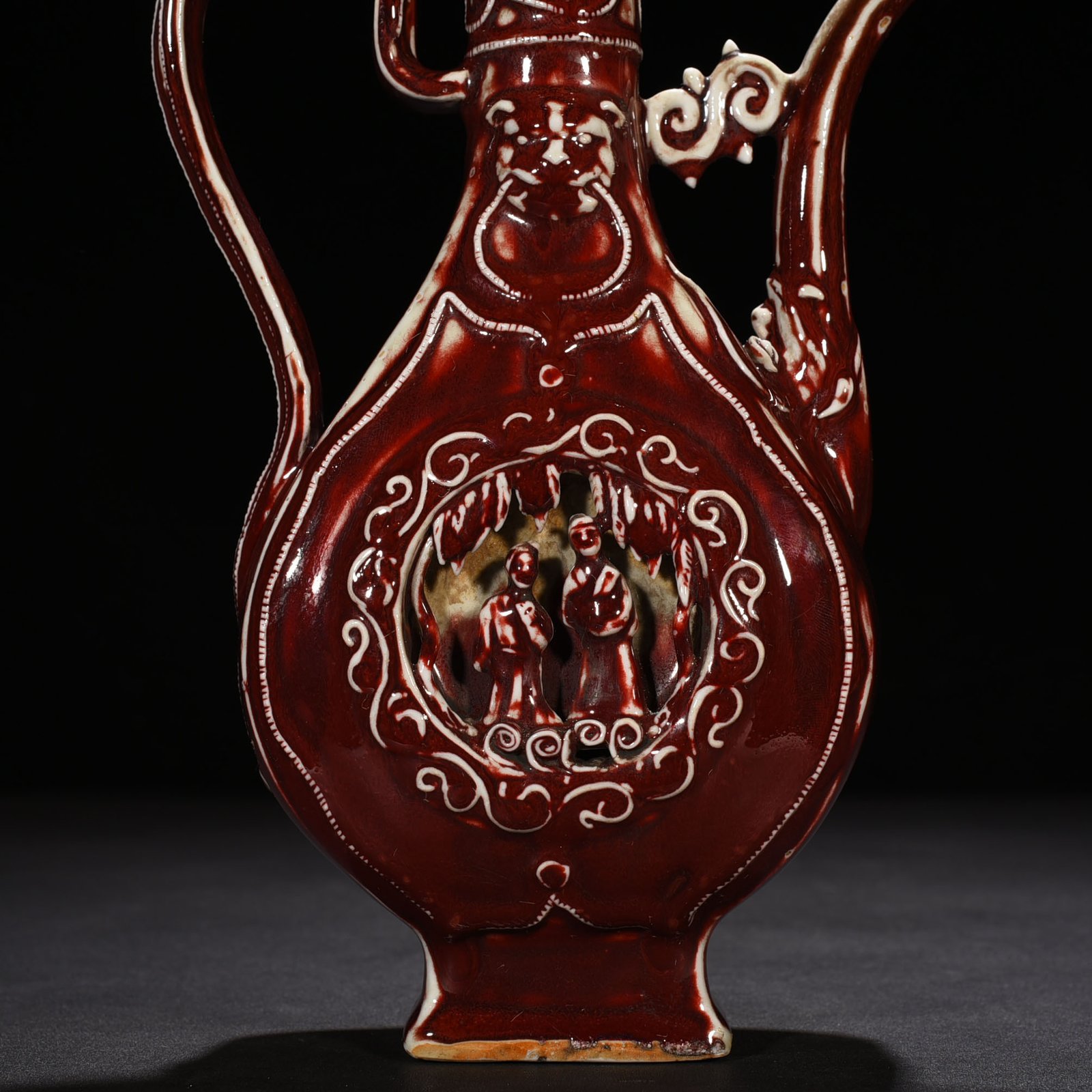 Yuan Dynasty red glaze hollow figure pattern holding pot