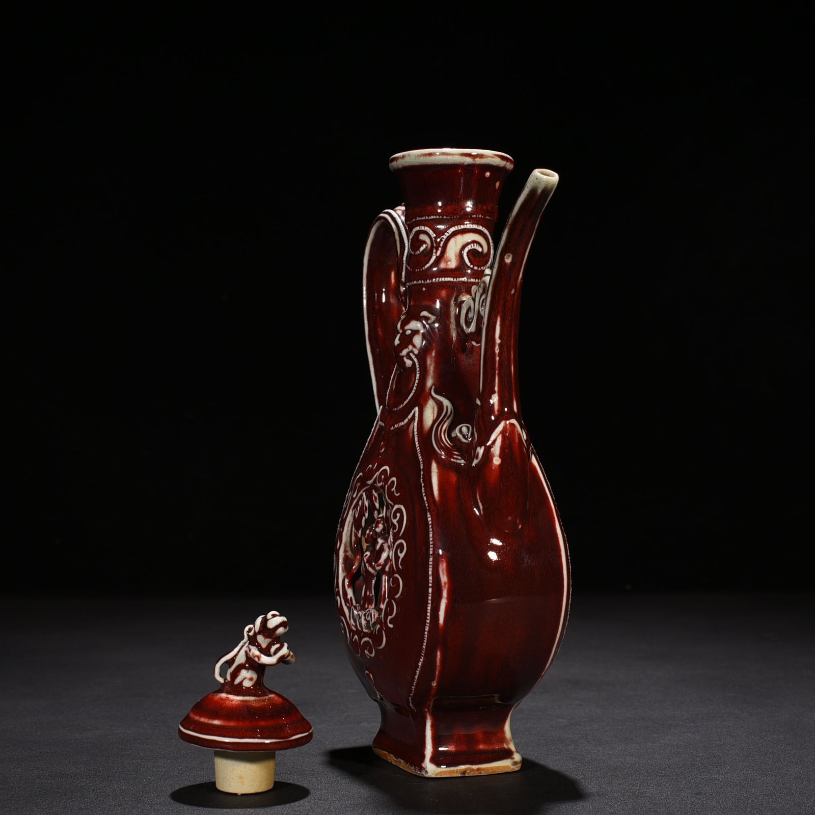 Yuan Dynasty red glaze hollow figure pattern holding pot