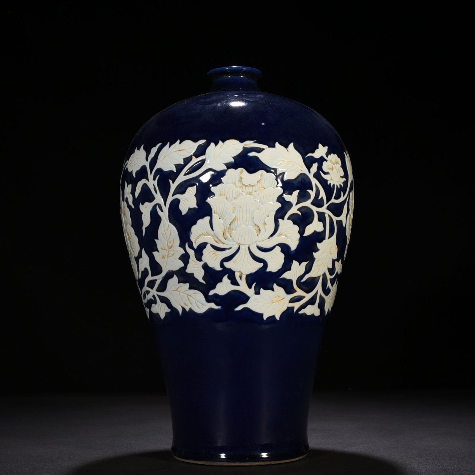 Yuan Dynasty blue glaze carved white plum vase with branches and peony pattern