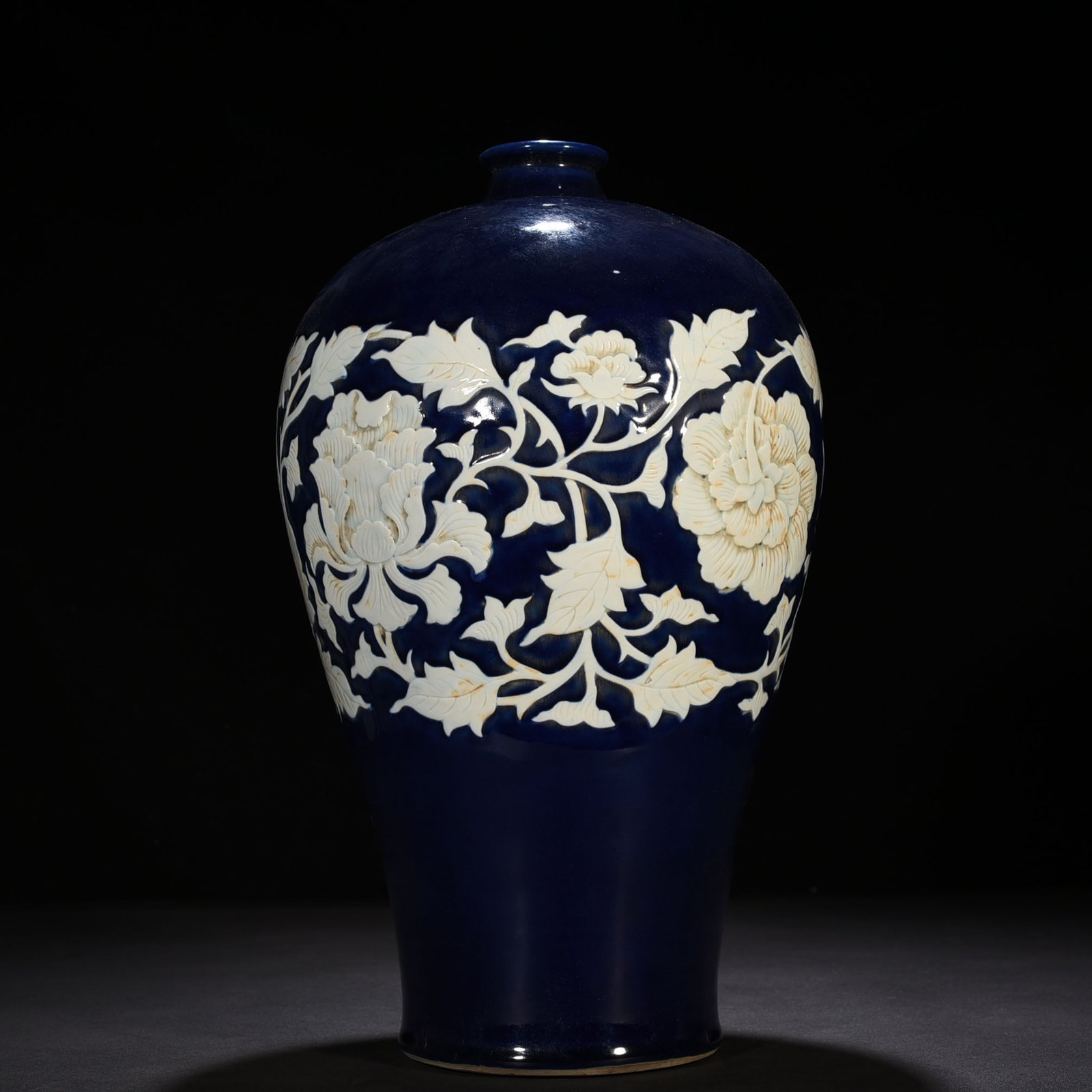Yuan Dynasty blue glaze carved white plum vase with branches and peony pattern