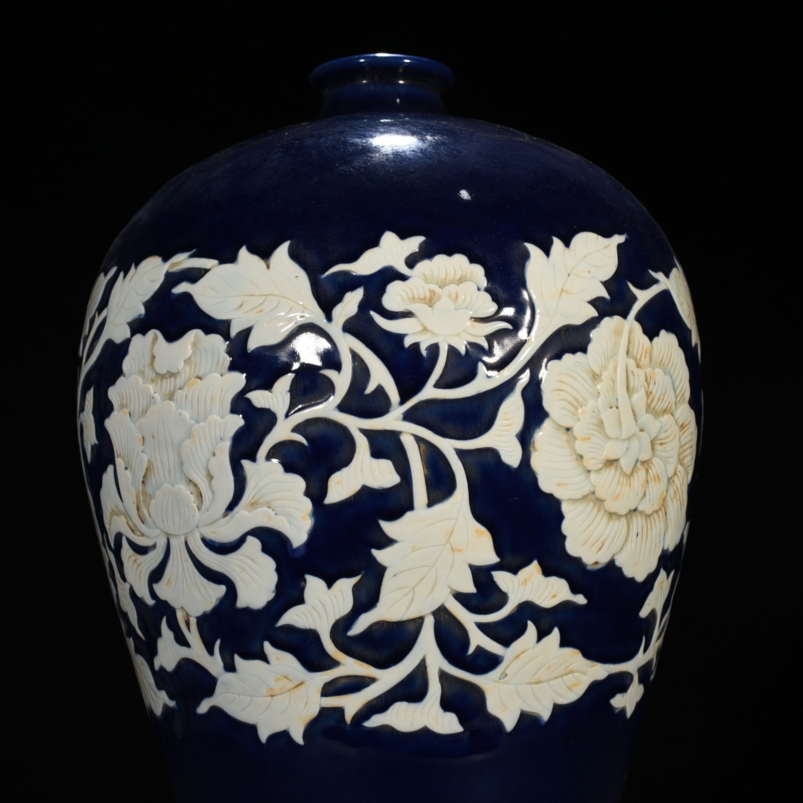 Yuan Dynasty blue glaze carved white plum vase with branches and peony pattern