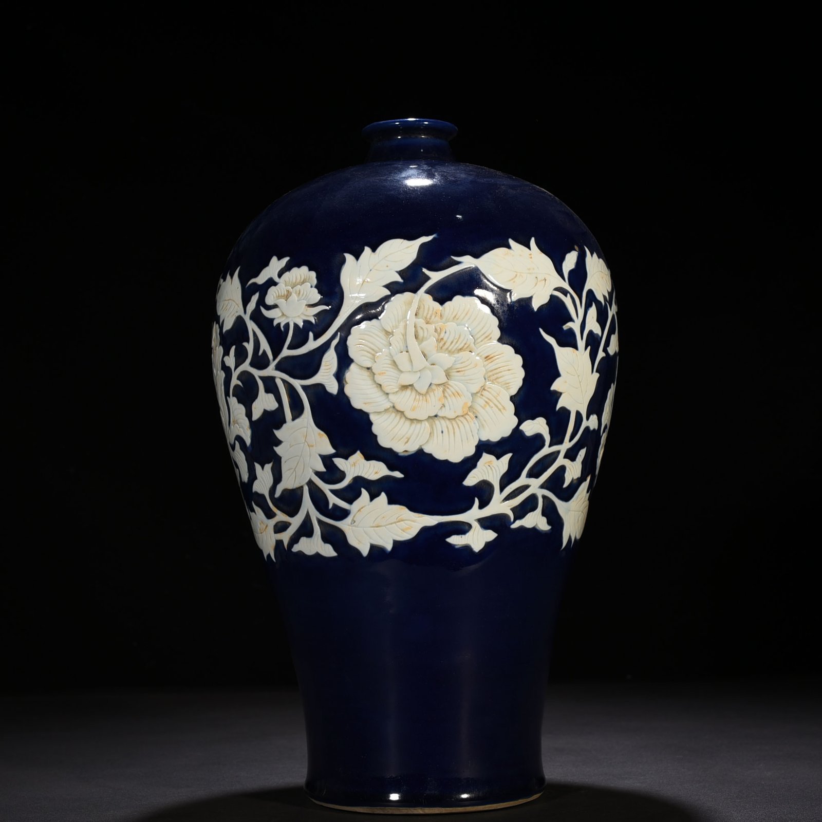 Yuan Dynasty blue glaze carved white plum vase with branches and peony pattern