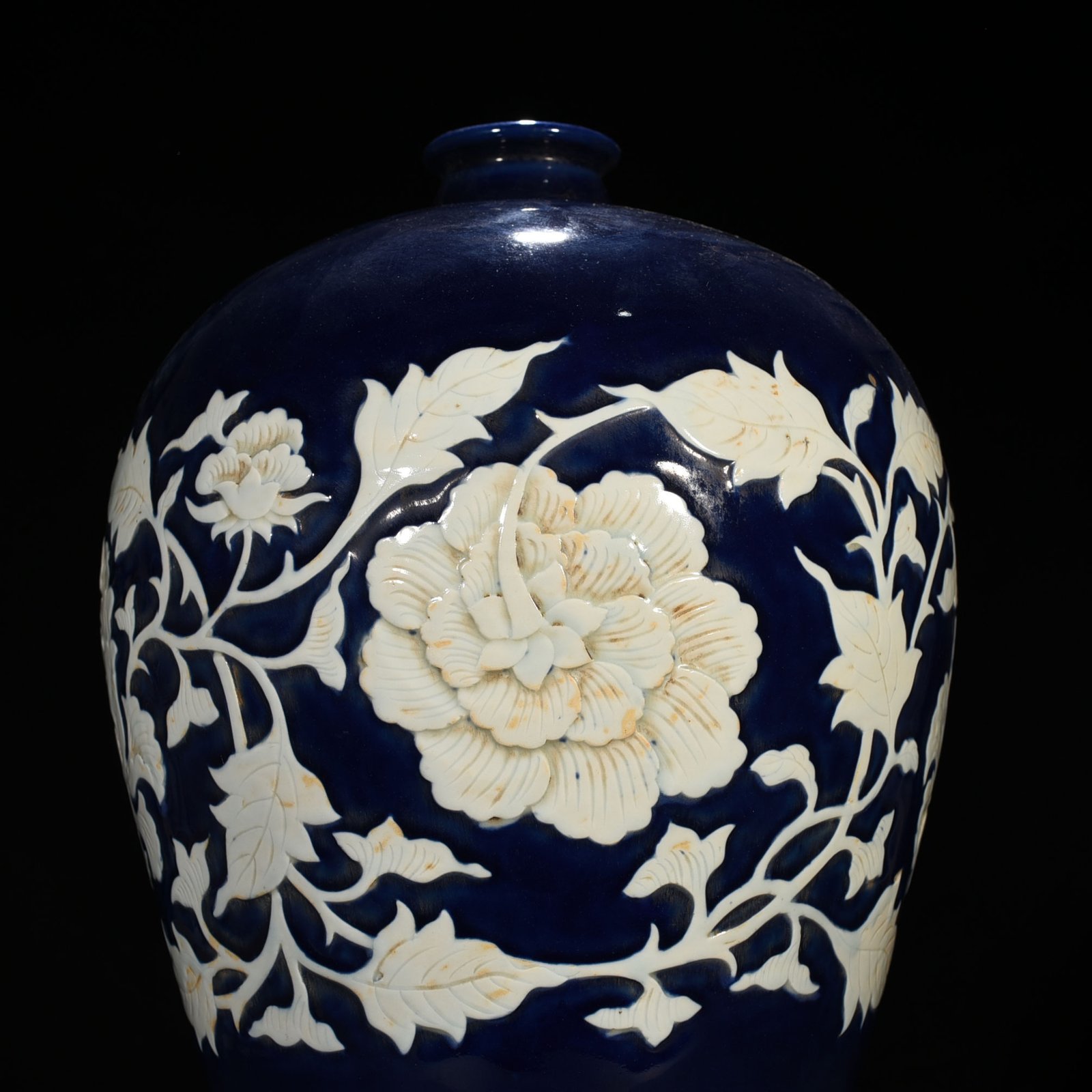 Yuan Dynasty blue glaze carved white plum vase with branches and peony pattern
