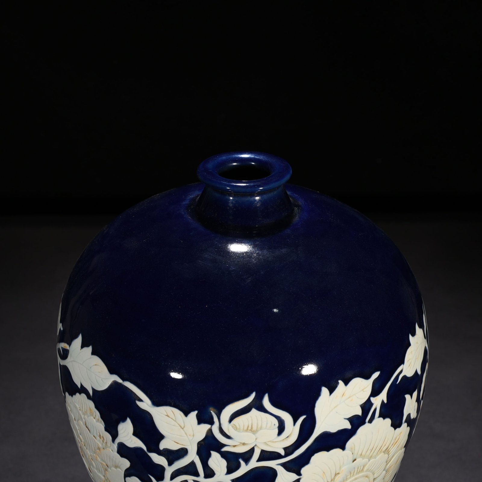 Yuan Dynasty blue glaze carved white plum vase with branches and peony pattern
