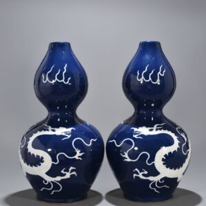 Yuan Dynasty blue glaze gourd vase with white dragon pattern