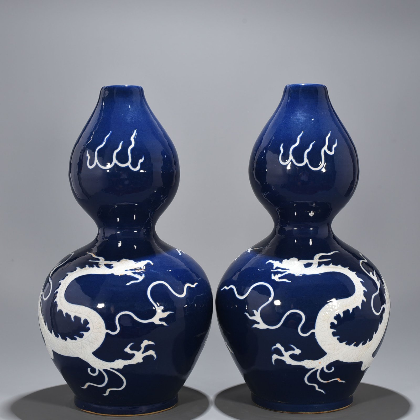 Yuan Dynasty blue glaze gourd vase with white dragon pattern