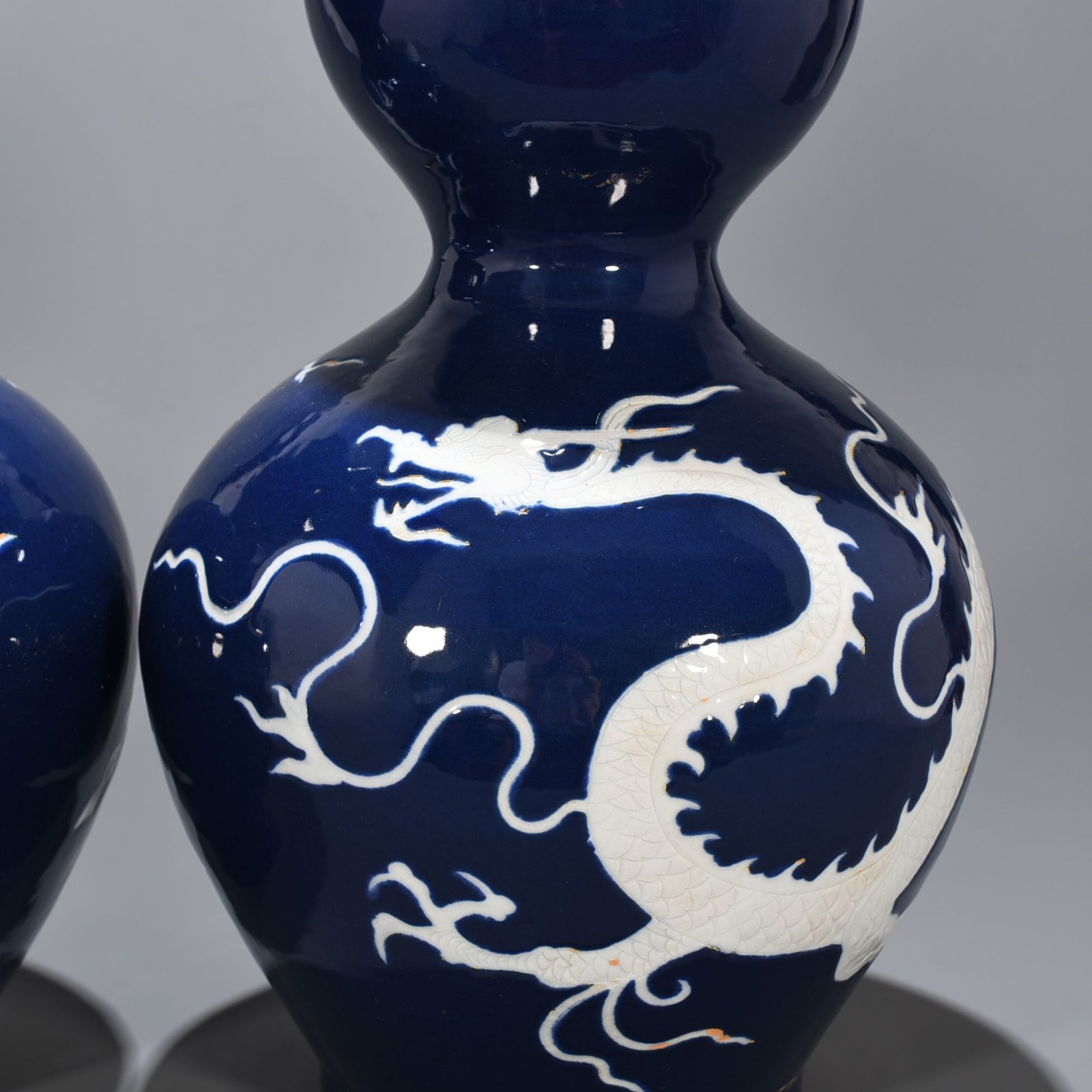 Yuan Dynasty blue glaze gourd vase with white dragon pattern