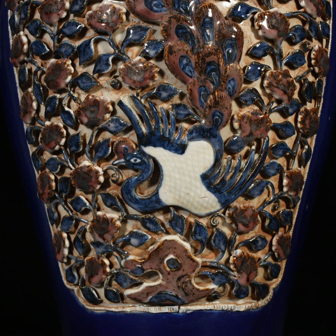 Yuan Dynasty blue glaze laminated blue and white plum vase with red underglaze peacock and peony pattern