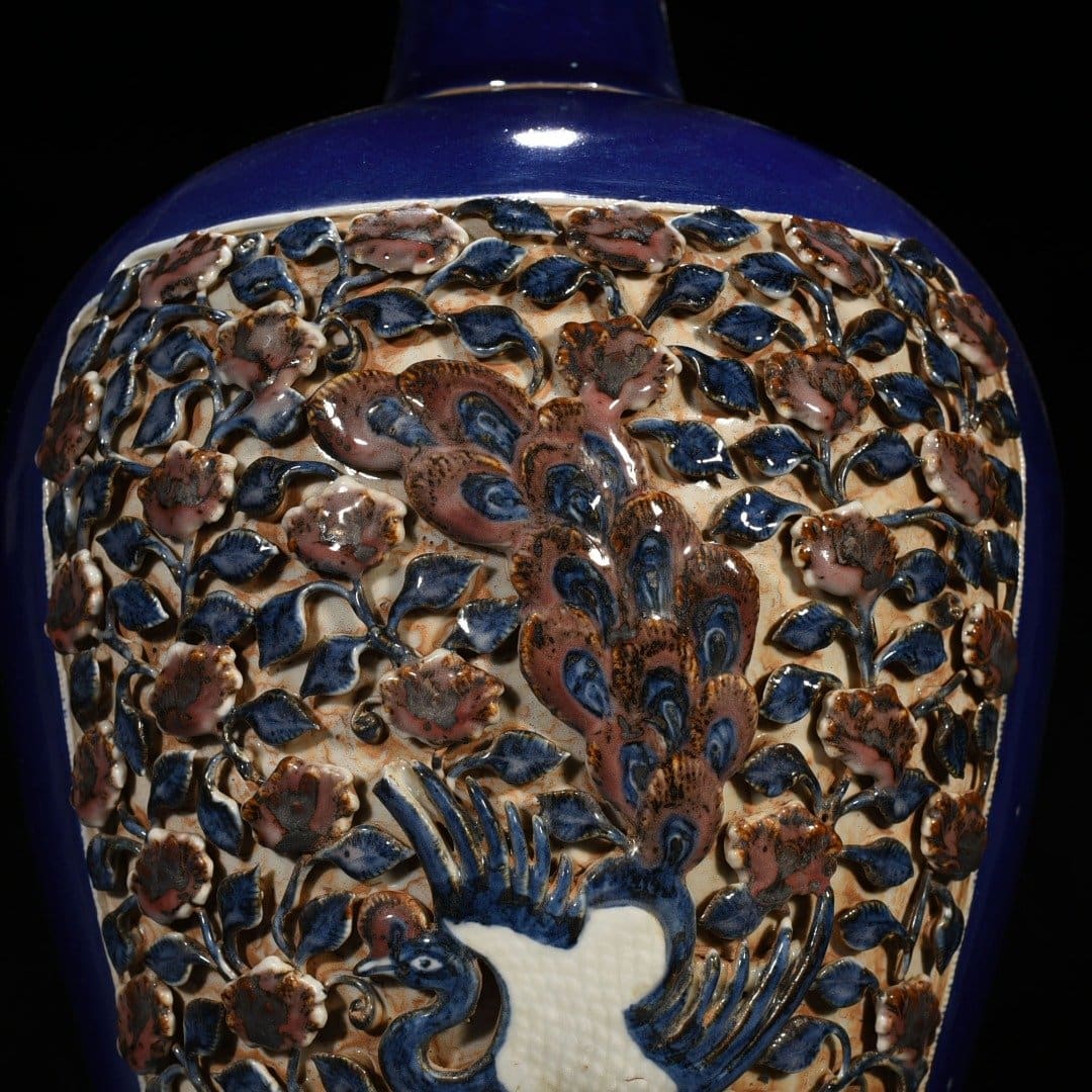 Yuan Dynasty blue glaze laminated blue and white plum vase with red underglaze peacock and peony pattern
