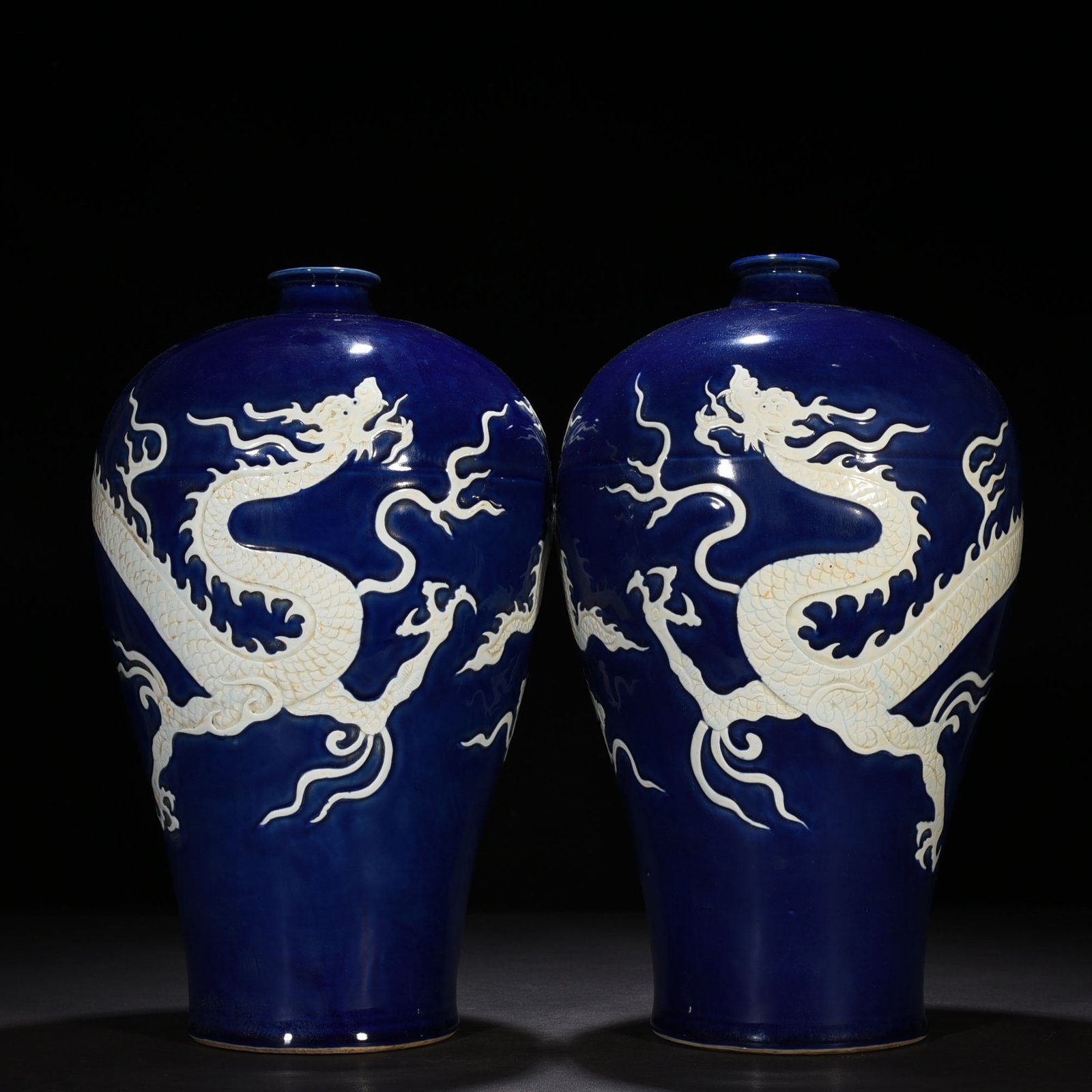 Yuan Dynasty blue glaze carved plum vase with white dragon pattern
