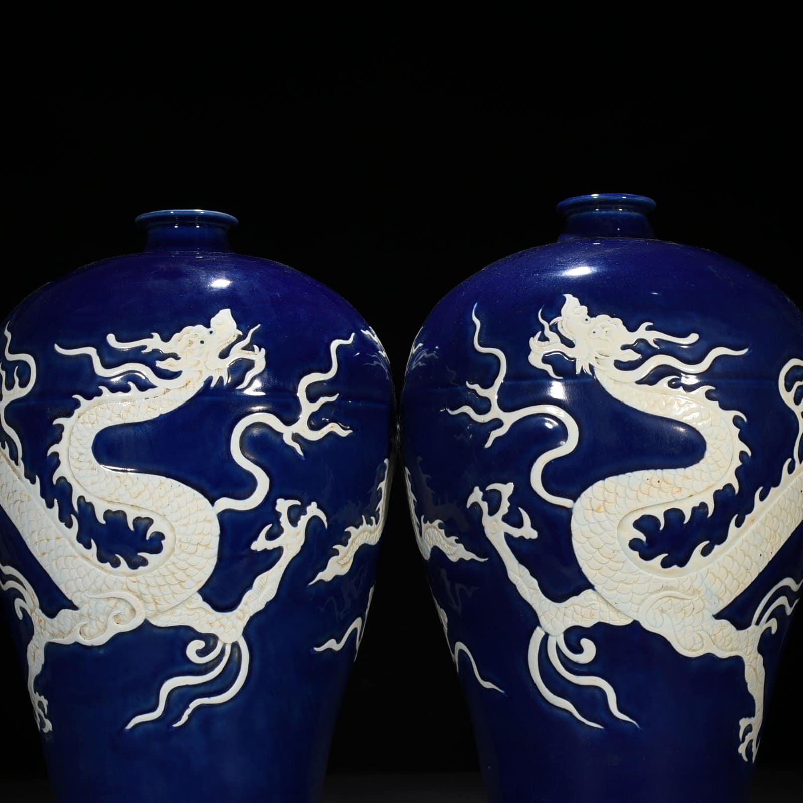 Yuan Dynasty blue glaze carved plum vase with white dragon pattern