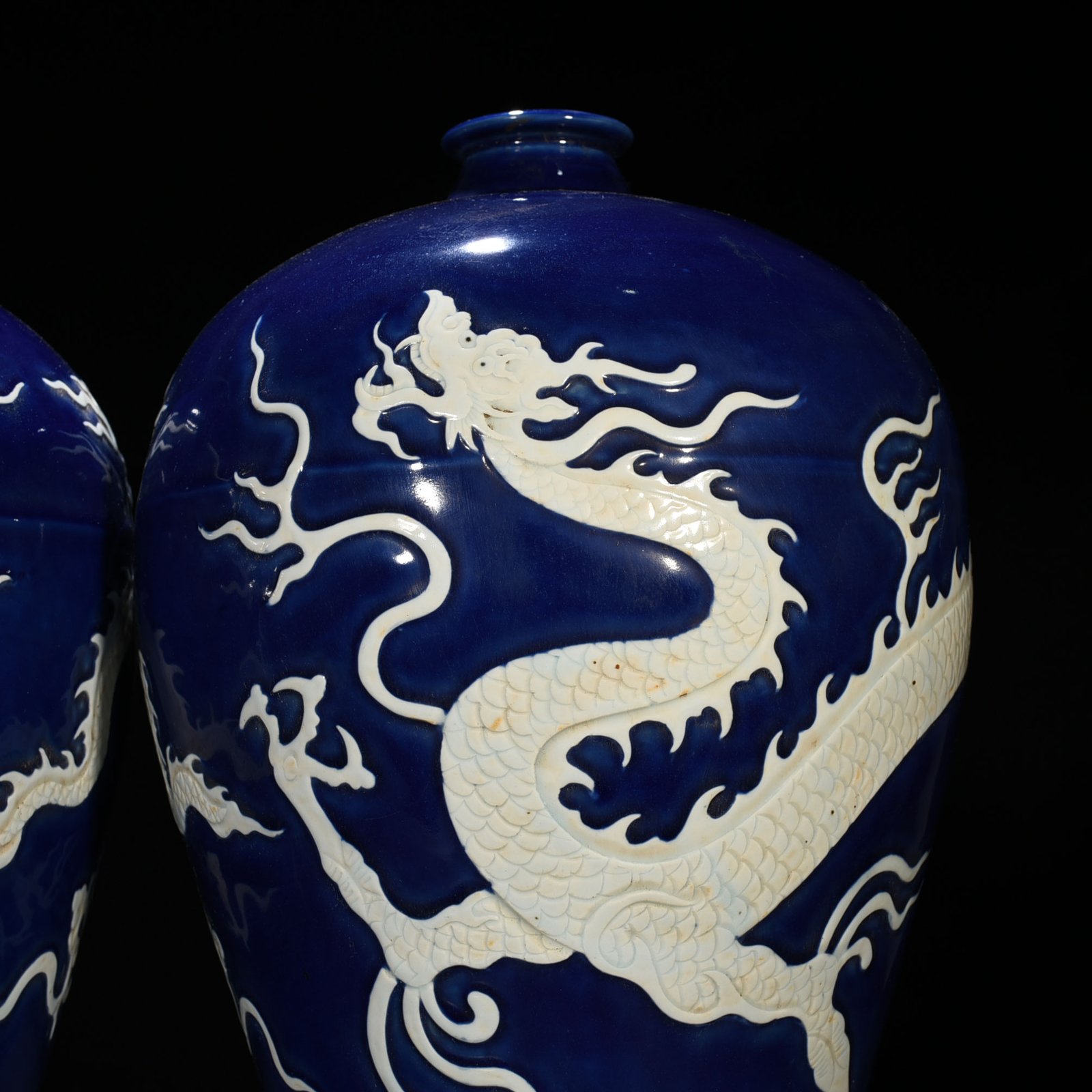 Yuan Dynasty blue glaze carved plum vase with white dragon pattern
