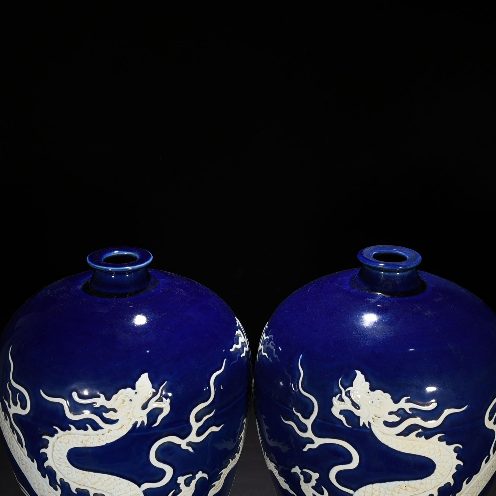 Yuan Dynasty blue glaze carved plum vase with white dragon pattern
