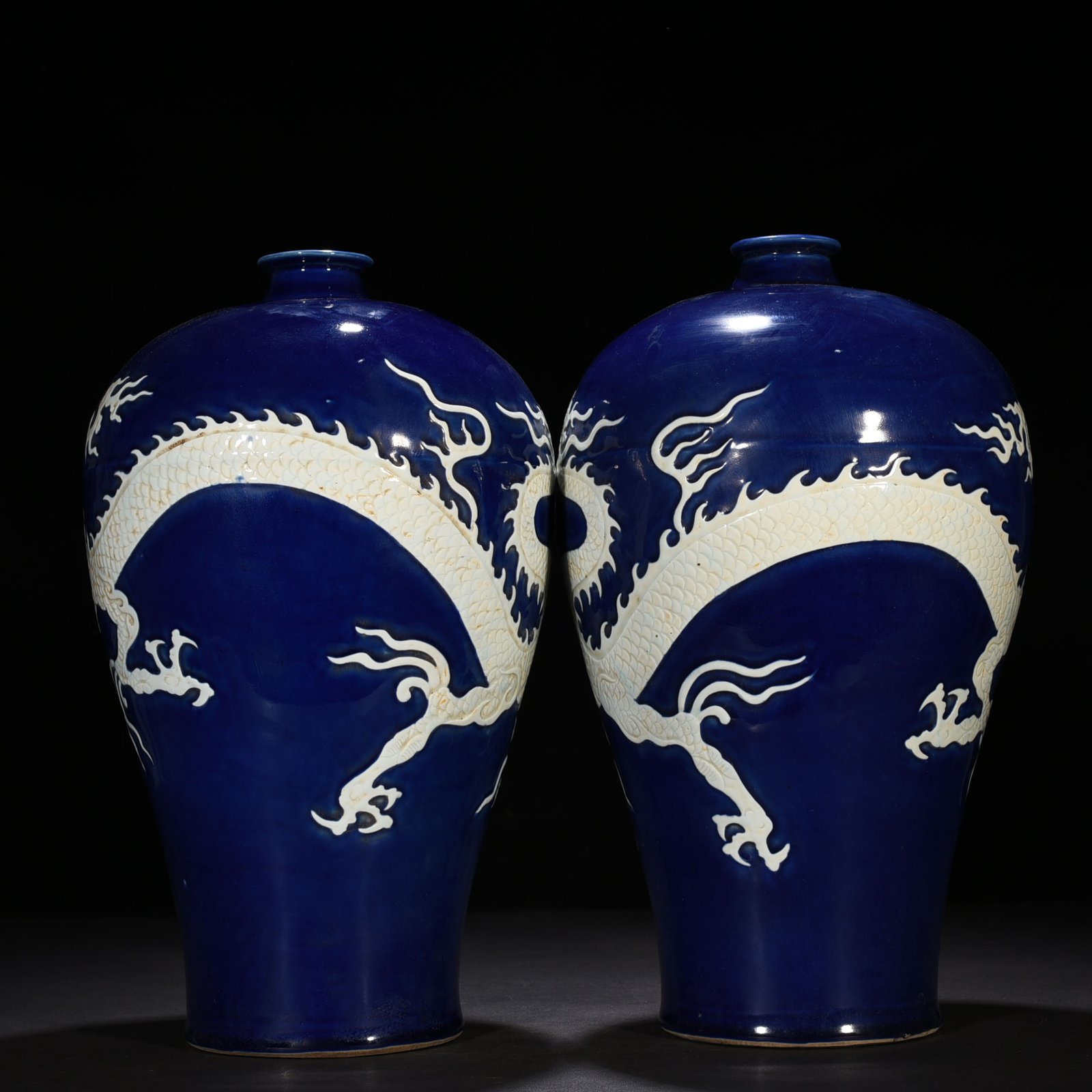 Yuan Dynasty blue glaze carved plum vase with white dragon pattern