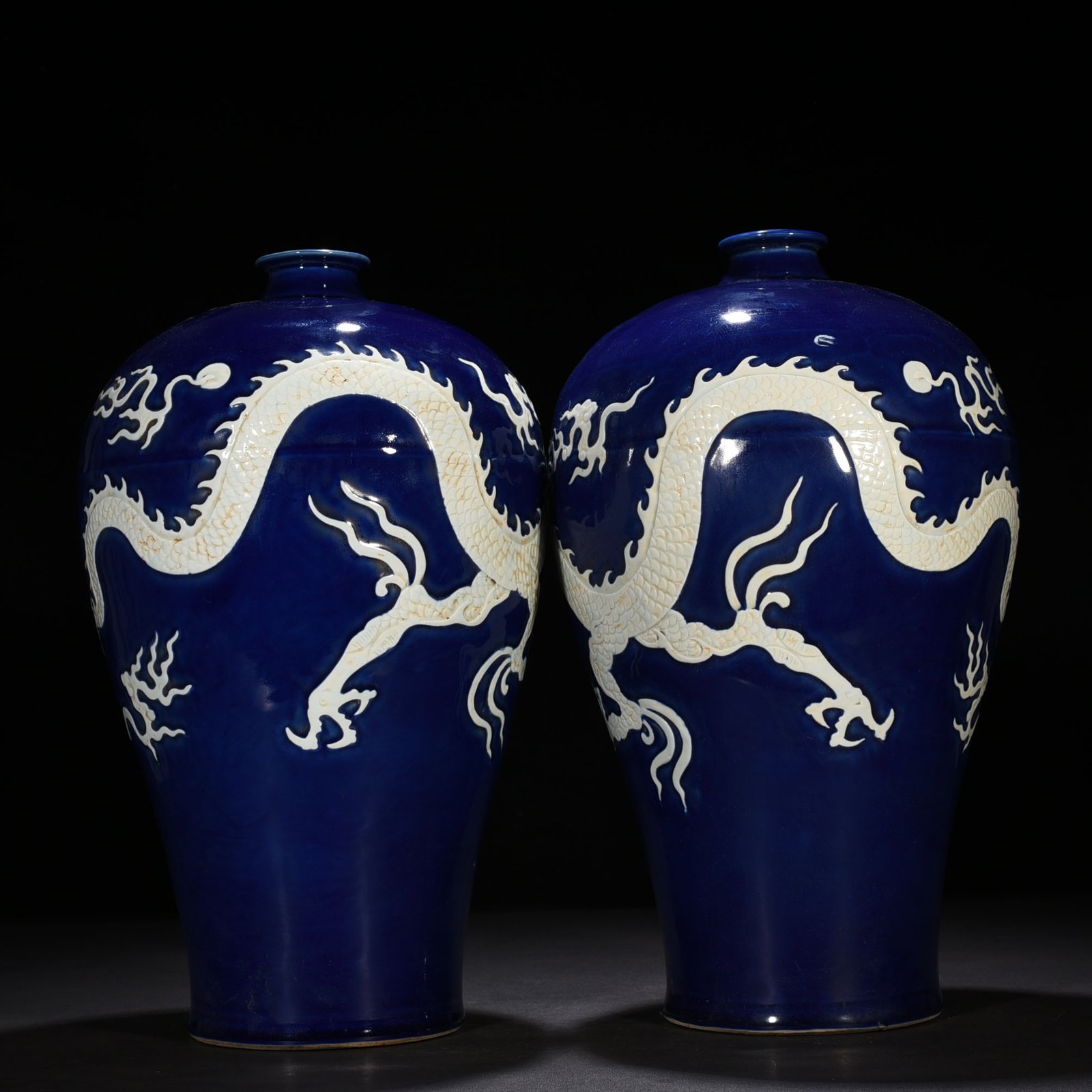 Yuan Dynasty blue glaze carved plum vase with white dragon pattern
