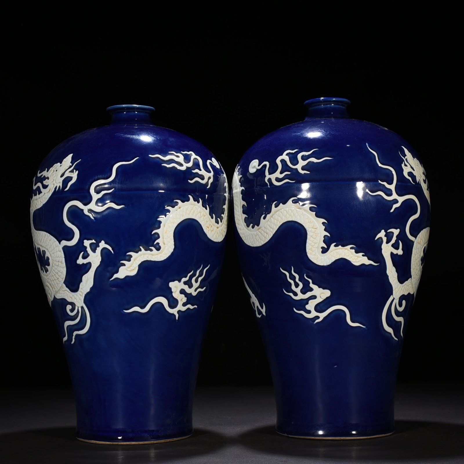 Yuan Dynasty blue glaze carved plum vase with white dragon pattern