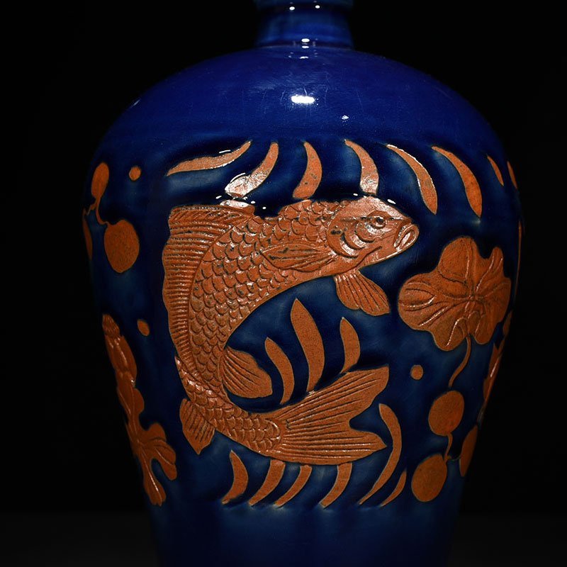 Yuan Dynasty blue glaze carved fish and algae pattern plum vase