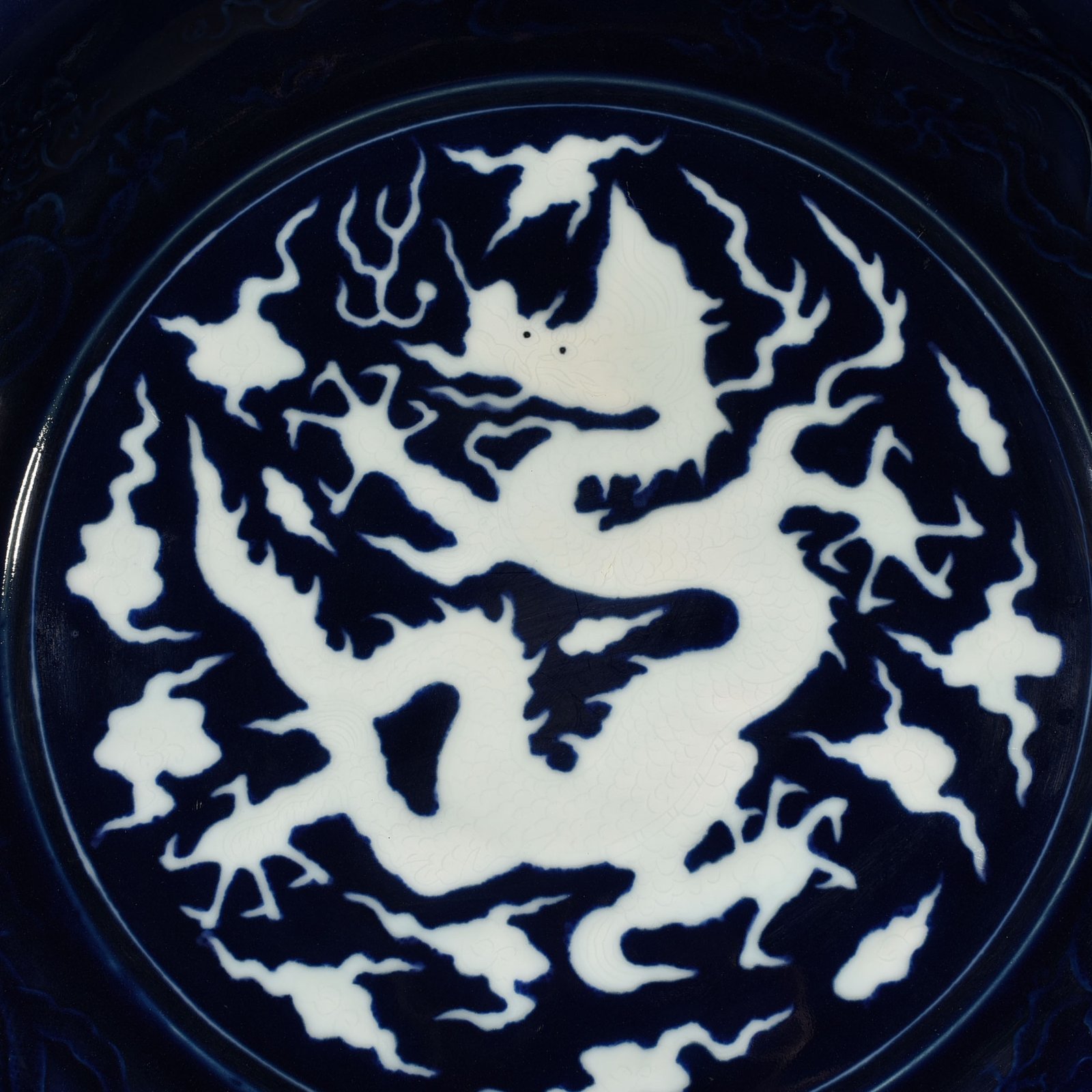 Yuan Dynasty blue glaze carved dragon plate