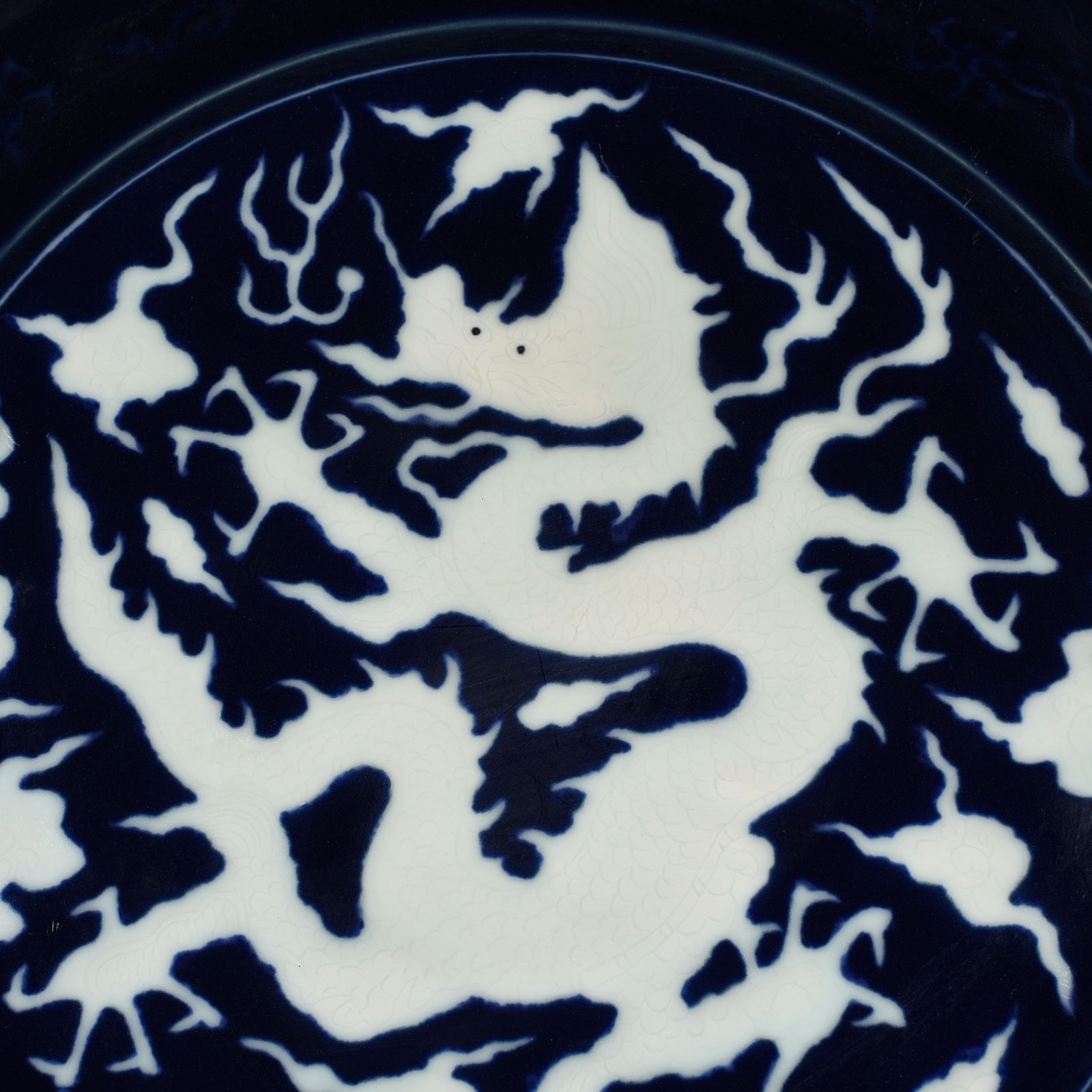 Yuan Dynasty blue glaze carved dragon plate