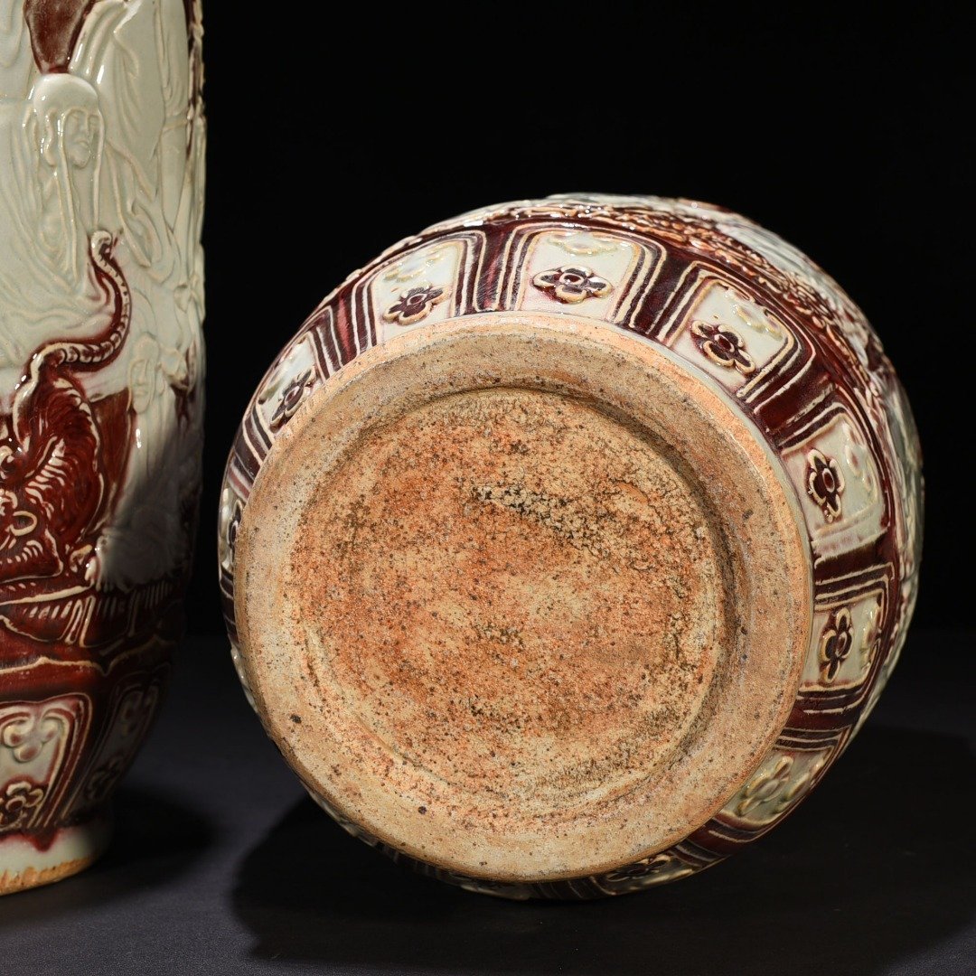 Yuan Dynasty underglaze red carved mallet vase with eighteen arhat figures