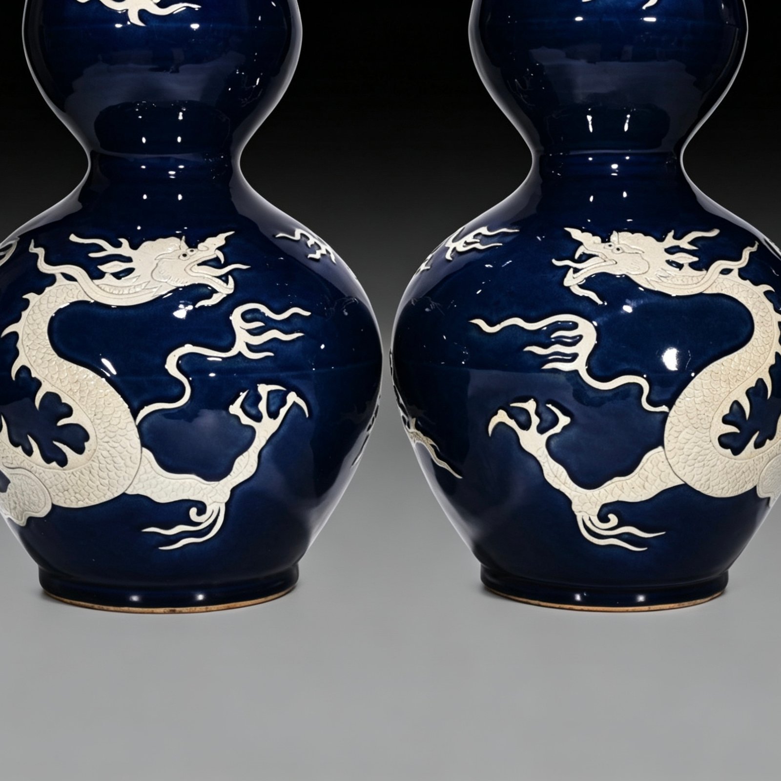 Yuan Dynasty blue gourd bottle with white engraved cloud and dragon pattern