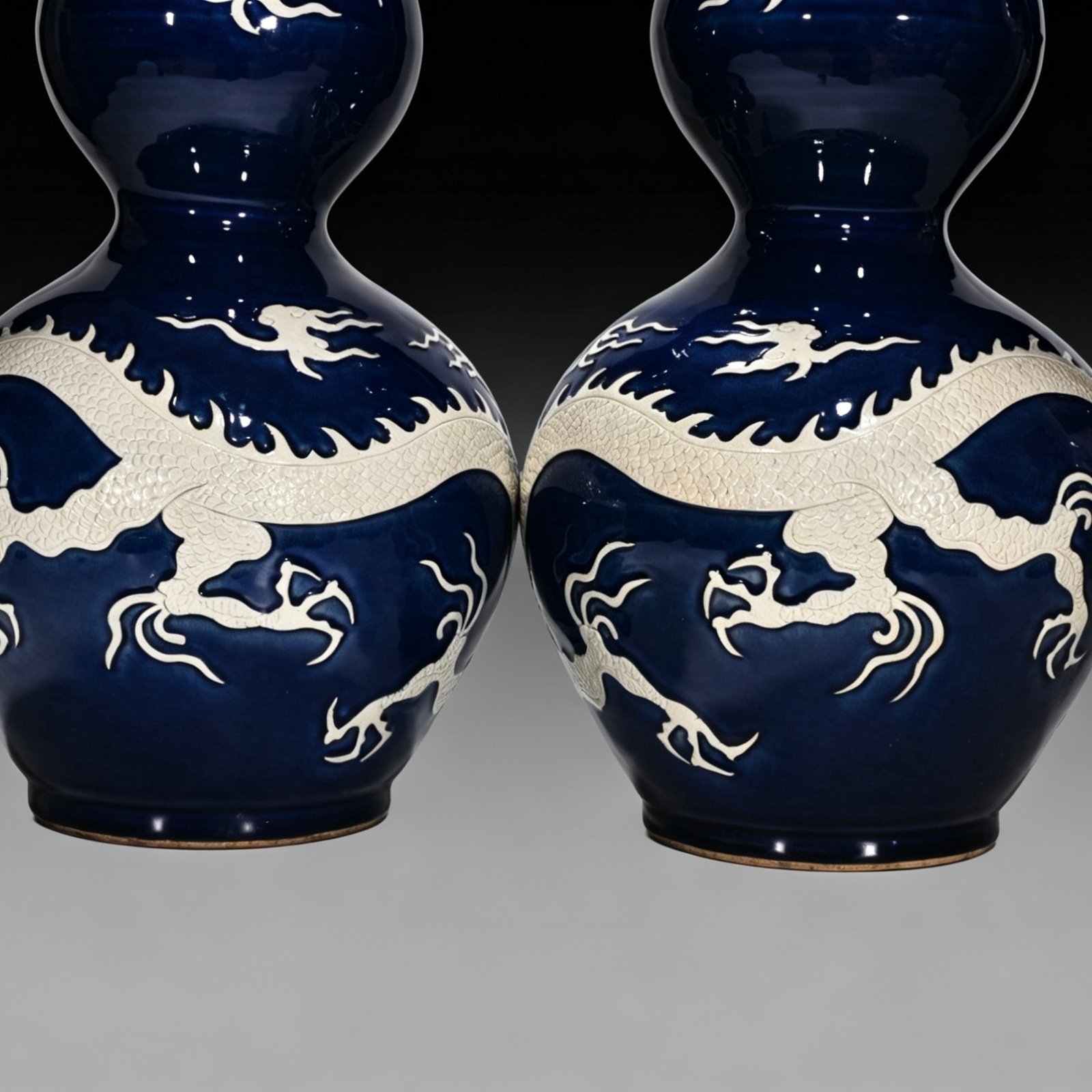 Yuan Dynasty blue gourd bottle with white engraved cloud and dragon pattern