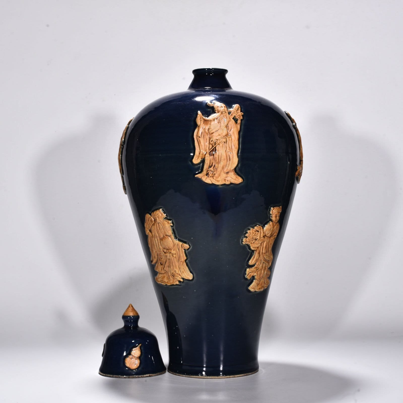 Yuan Dynasty blue glaze embossed plum vase with figures of the Eight Immortals