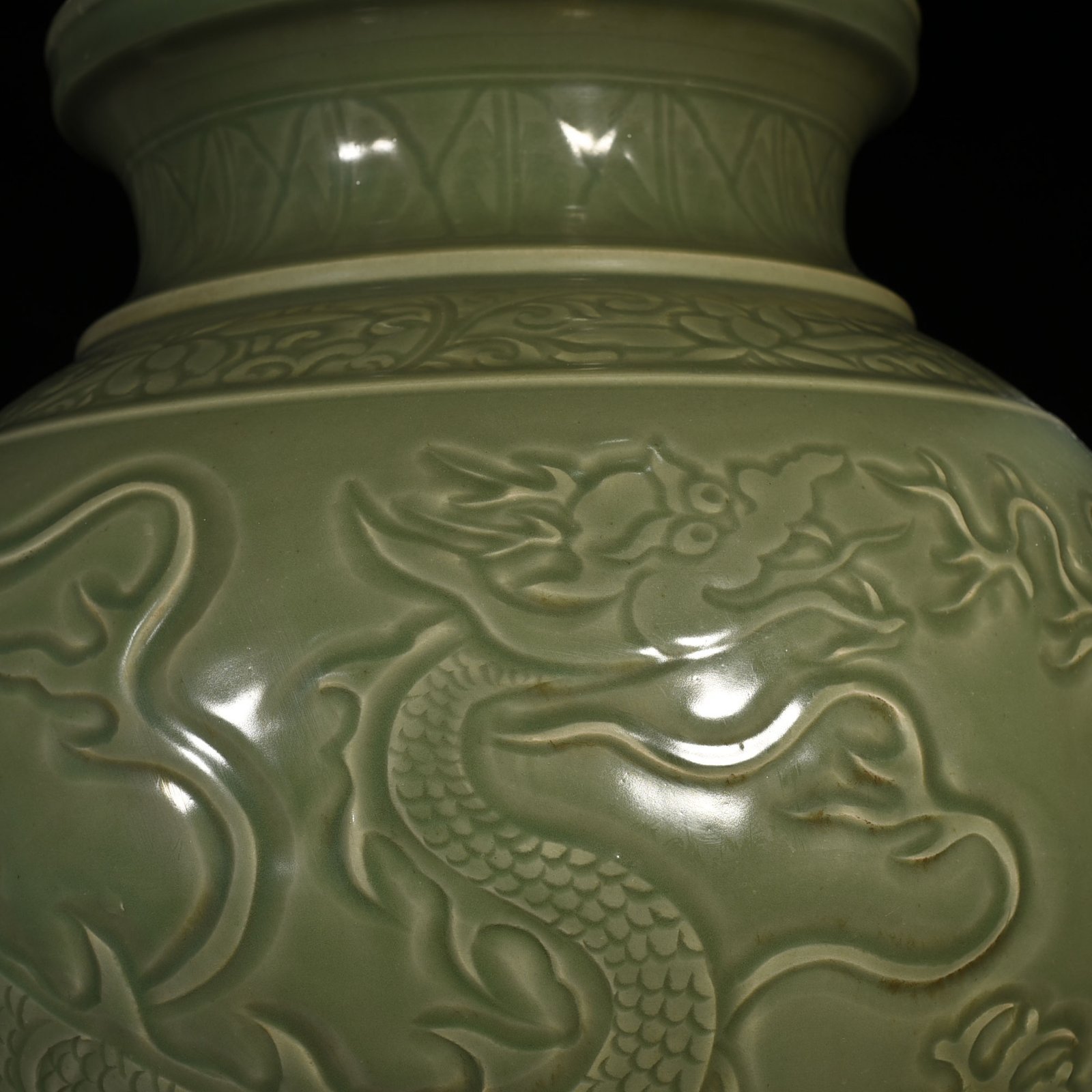 Yuan Dynasty large jar with carved dragon and animal ears