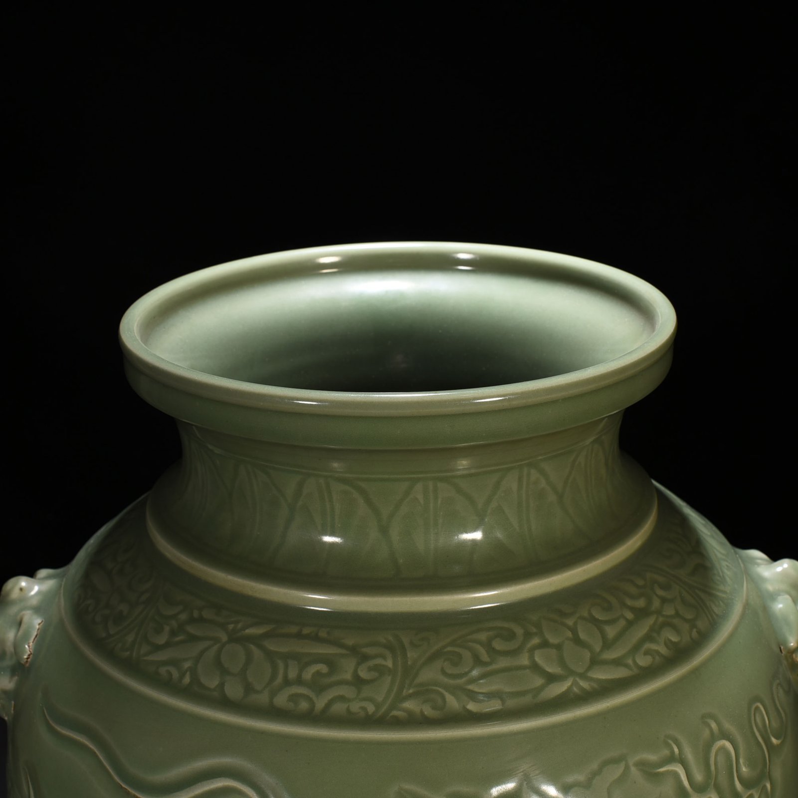 Yuan Dynasty large jar with carved dragon and animal ears