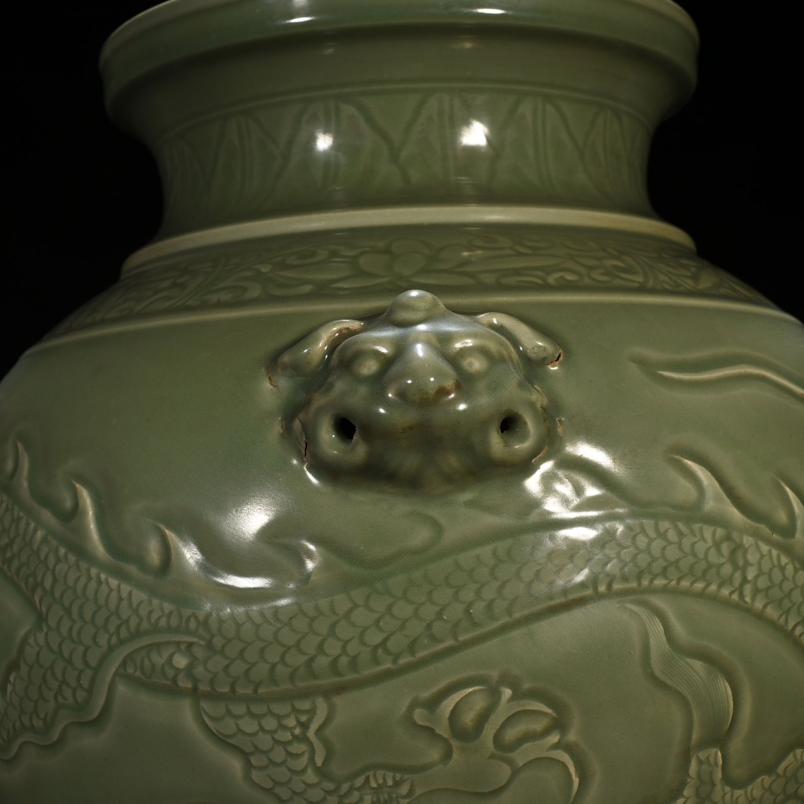 Yuan Dynasty large jar with carved dragon and animal ears